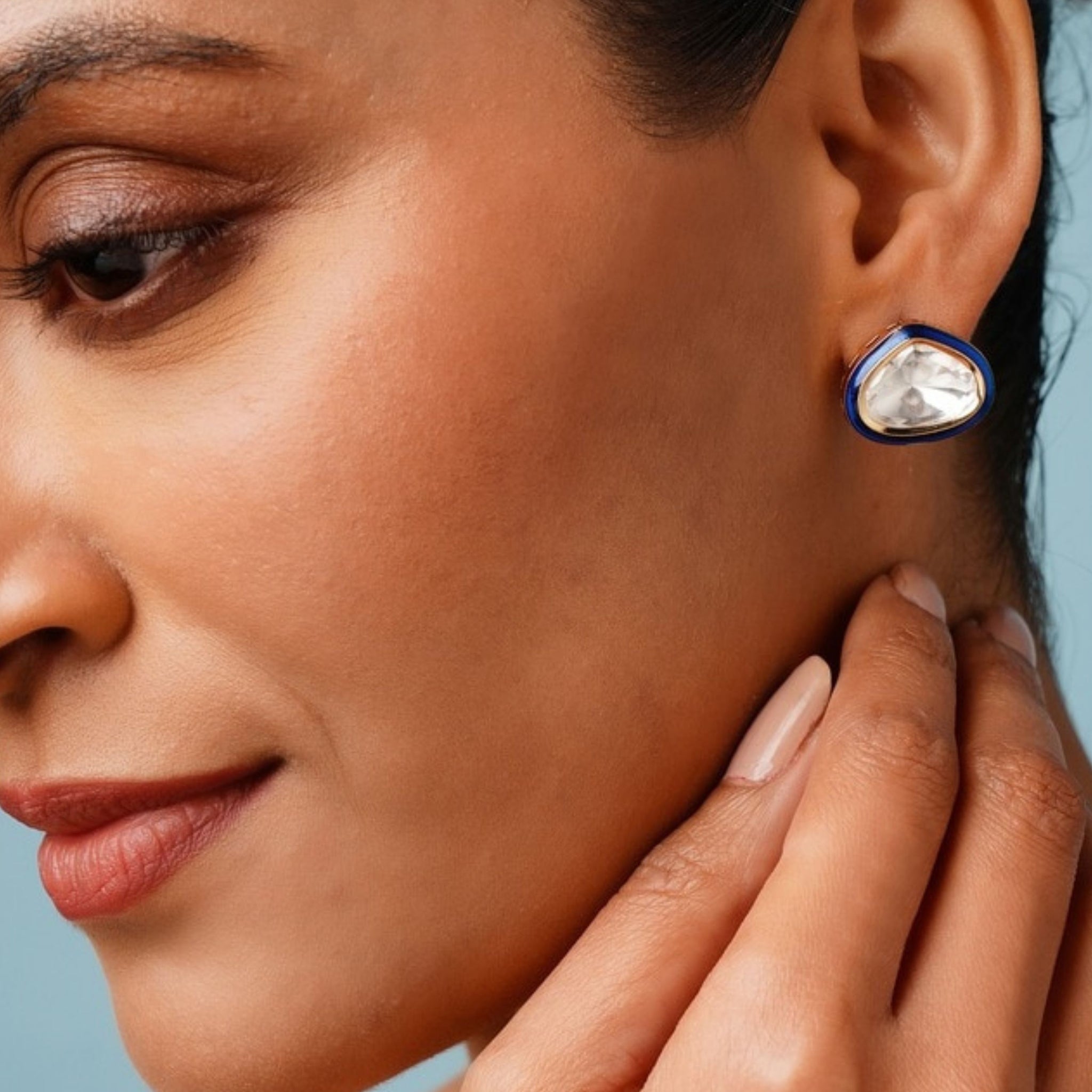 Close-up of woman wearing Gold Uncut Polki Diamond Stud Earrings by Abdesignsjewellery