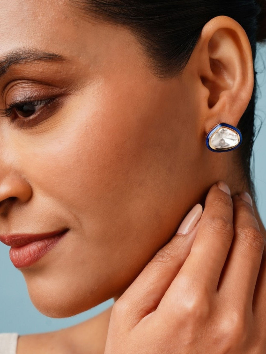 Close-up of woman wearing Gold Uncut Polki Diamond Stud Earrings by Abdesignsjewellery