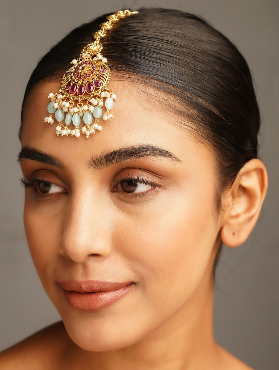 Golden Plated KempStone Studed Maangtikka worn by woman with smooth hairstyle and neutral makeup