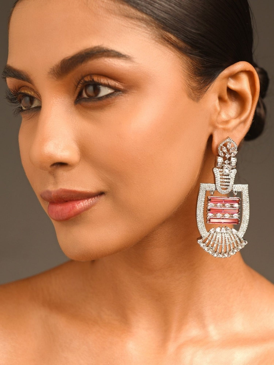 Heavy Silver Plated American Diamond Earring worn by model showcasing intricate design and pink stone details