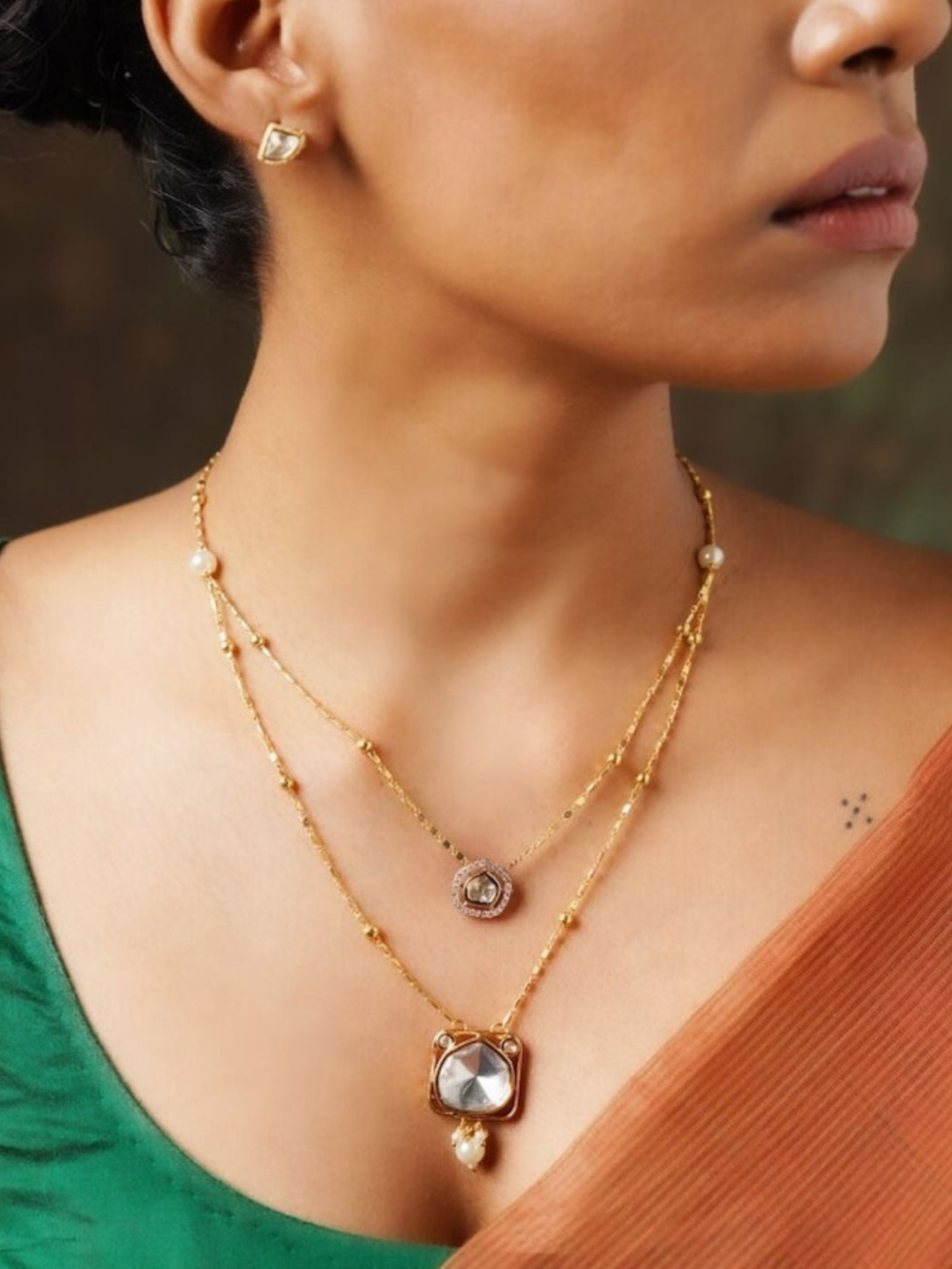 Abdesignsjewellery High Quality Polki Layered Necklace Set worn by a woman with gold tone and pearl accents