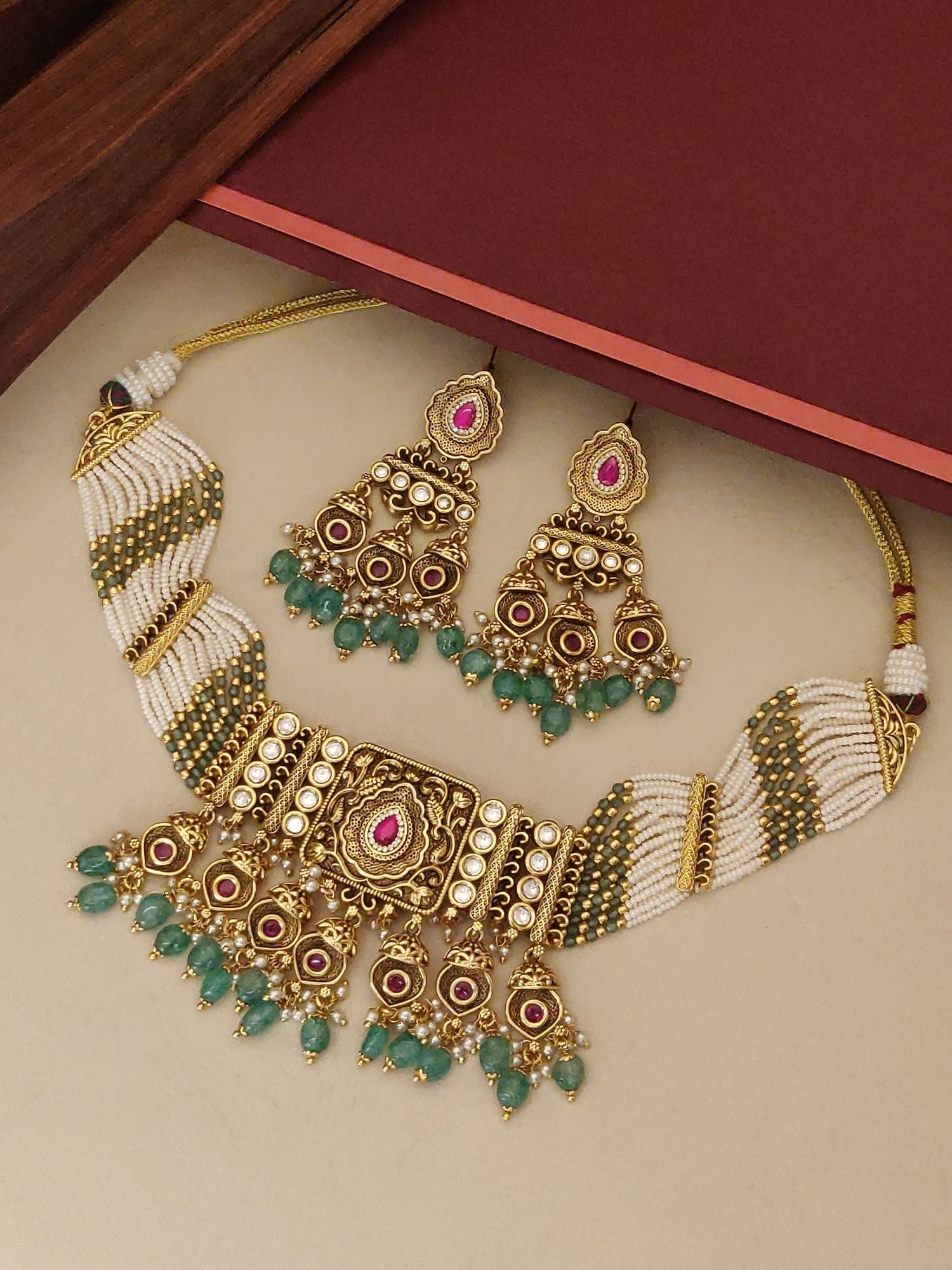 Kundan Gold Plated Necklace Set with matching earrings adorned with colorful stones