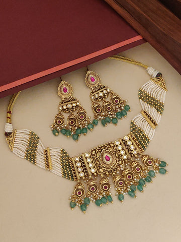 Kundan Gold Plated Necklace Set with intricate design and complementary earrings featuring green beads