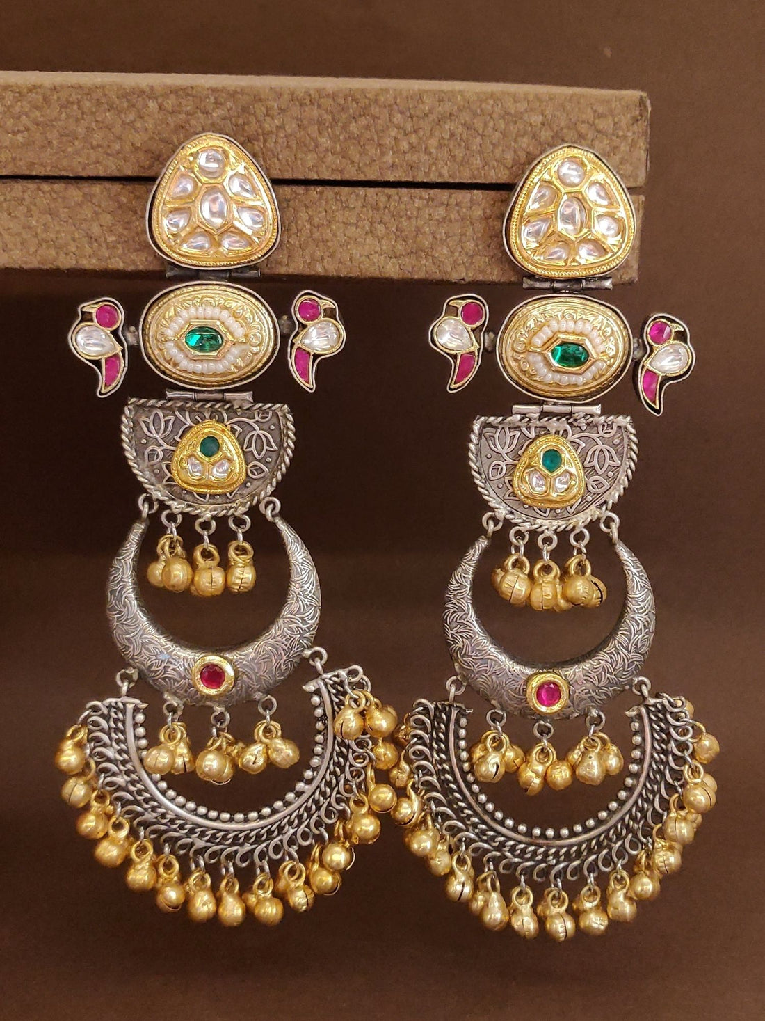Long Dual Tone Pachi Kundan Chandbali Earrings by Abdesignsjewellery worn on woman’s ear with gold and silver detailing