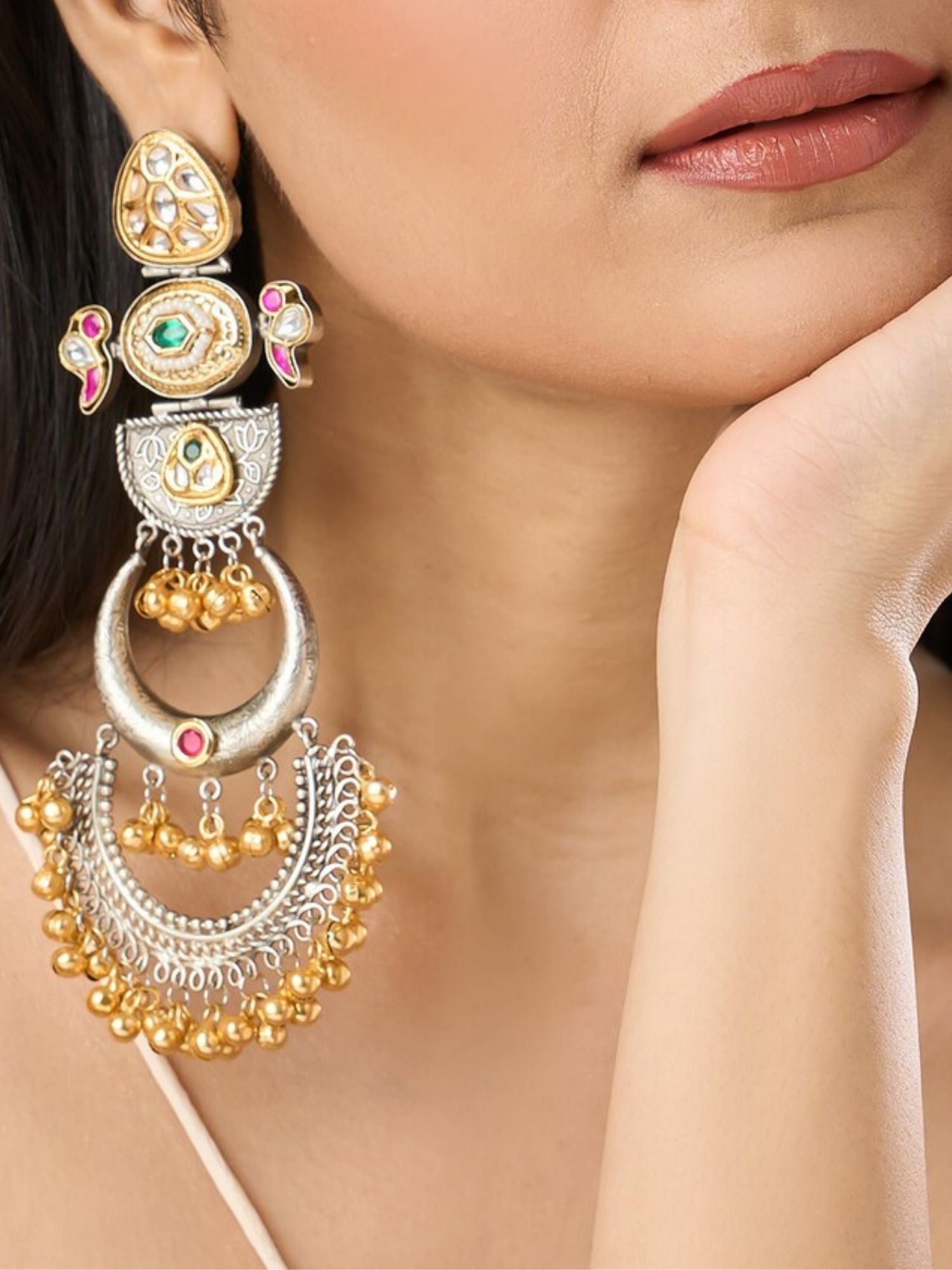 Long Dual Tone Pachi Kundan Chandbali Earrings by Abdesignsjewellery worn on woman’s ear with gold and silver detailing