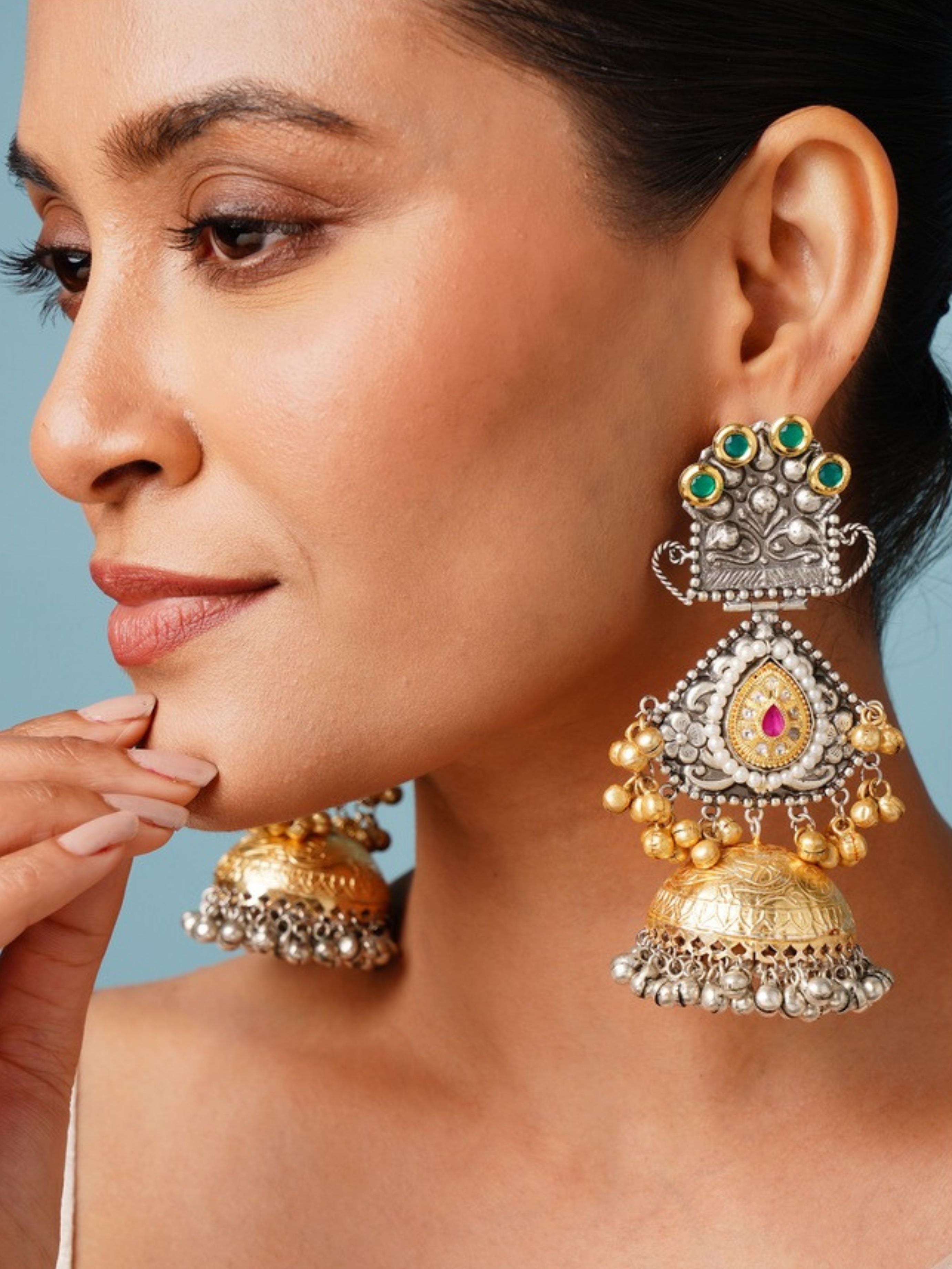 Long DualTone Plated Celebrity Style Jhumka Earrings by Abdesignsjewellery worn on woman with intricate gold and silver detailing