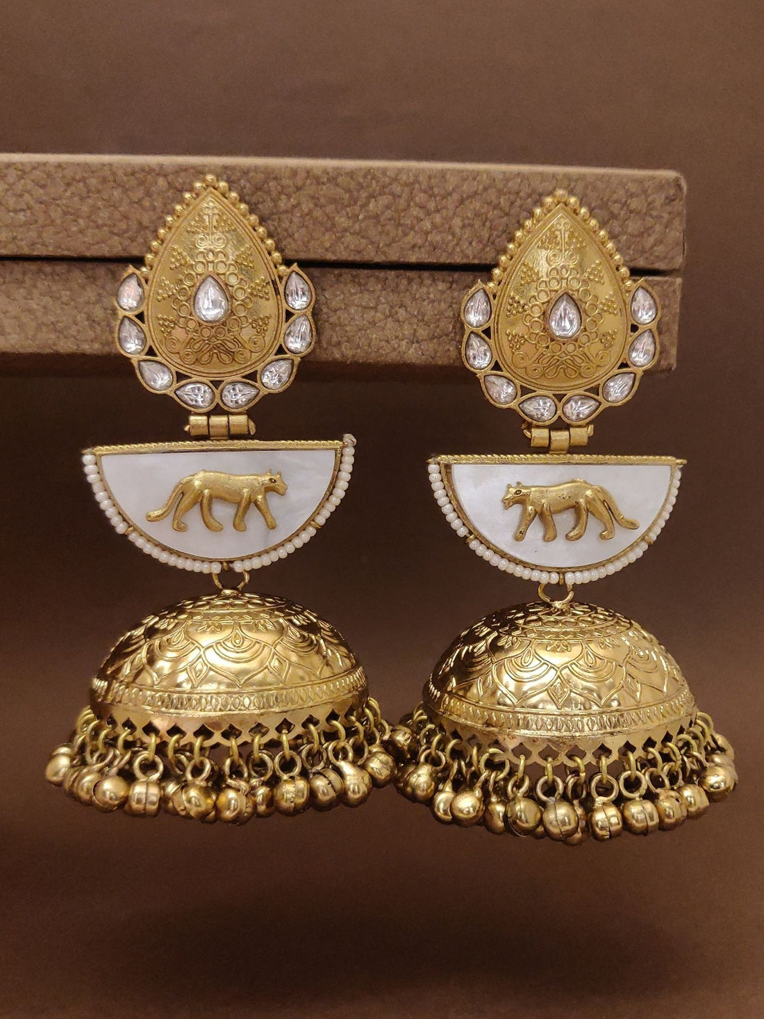 Long Gold Plated Plated Jhumka Earring featuring intricate designs and detailed embellishments