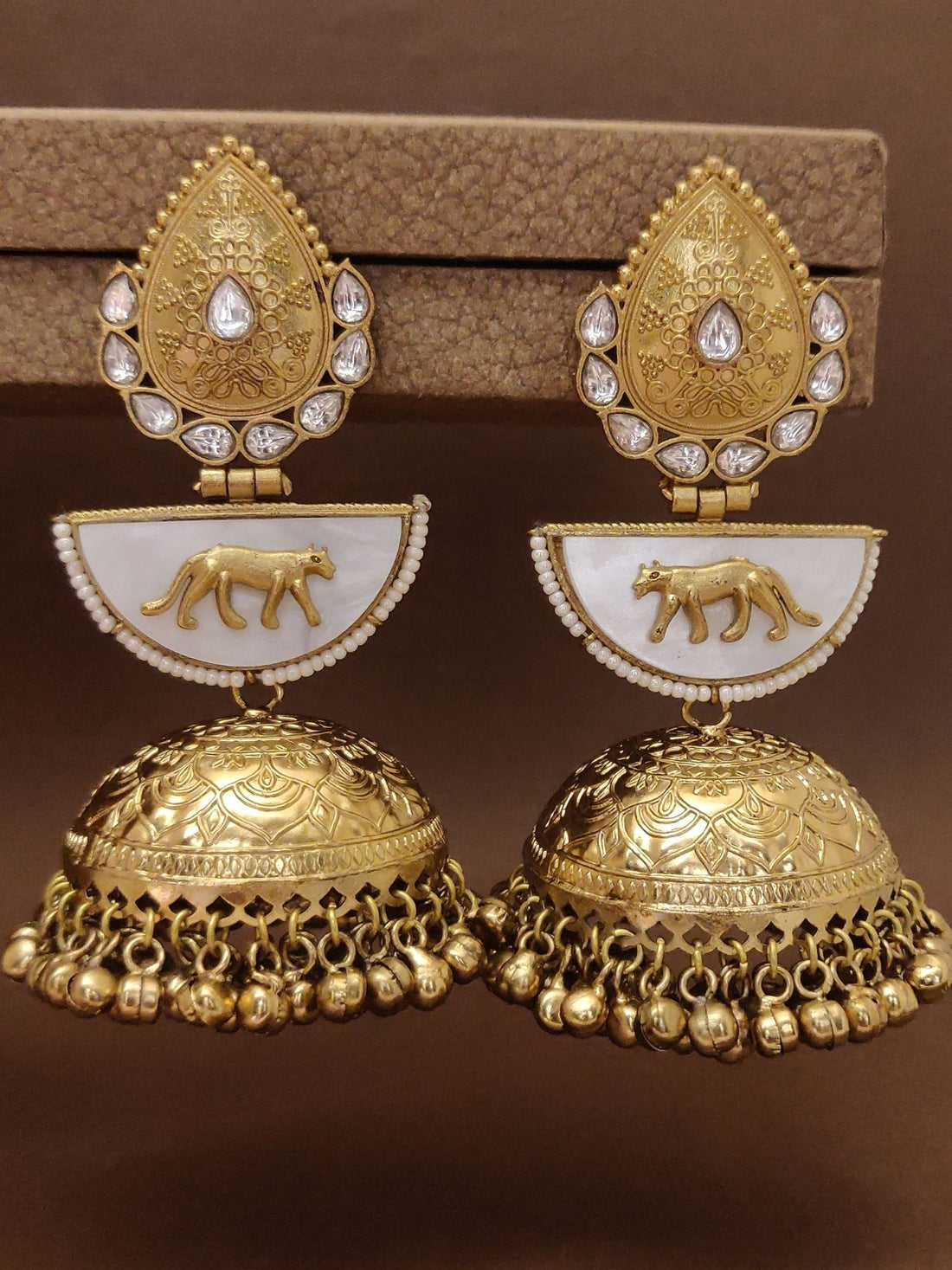 Long Gold Plated Plated Jhumka Earring featuring intricate designs and detailed embellishments