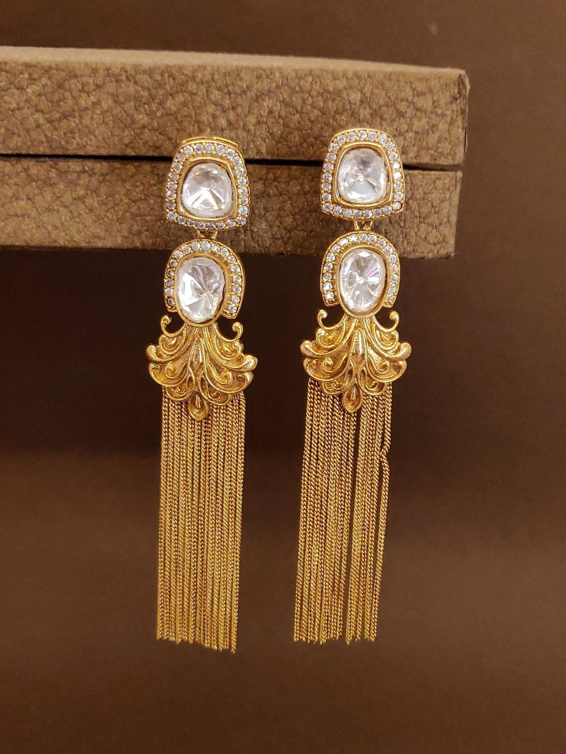 Stunning long gold plated polki earrings with intricate design and elegant fringe detail
