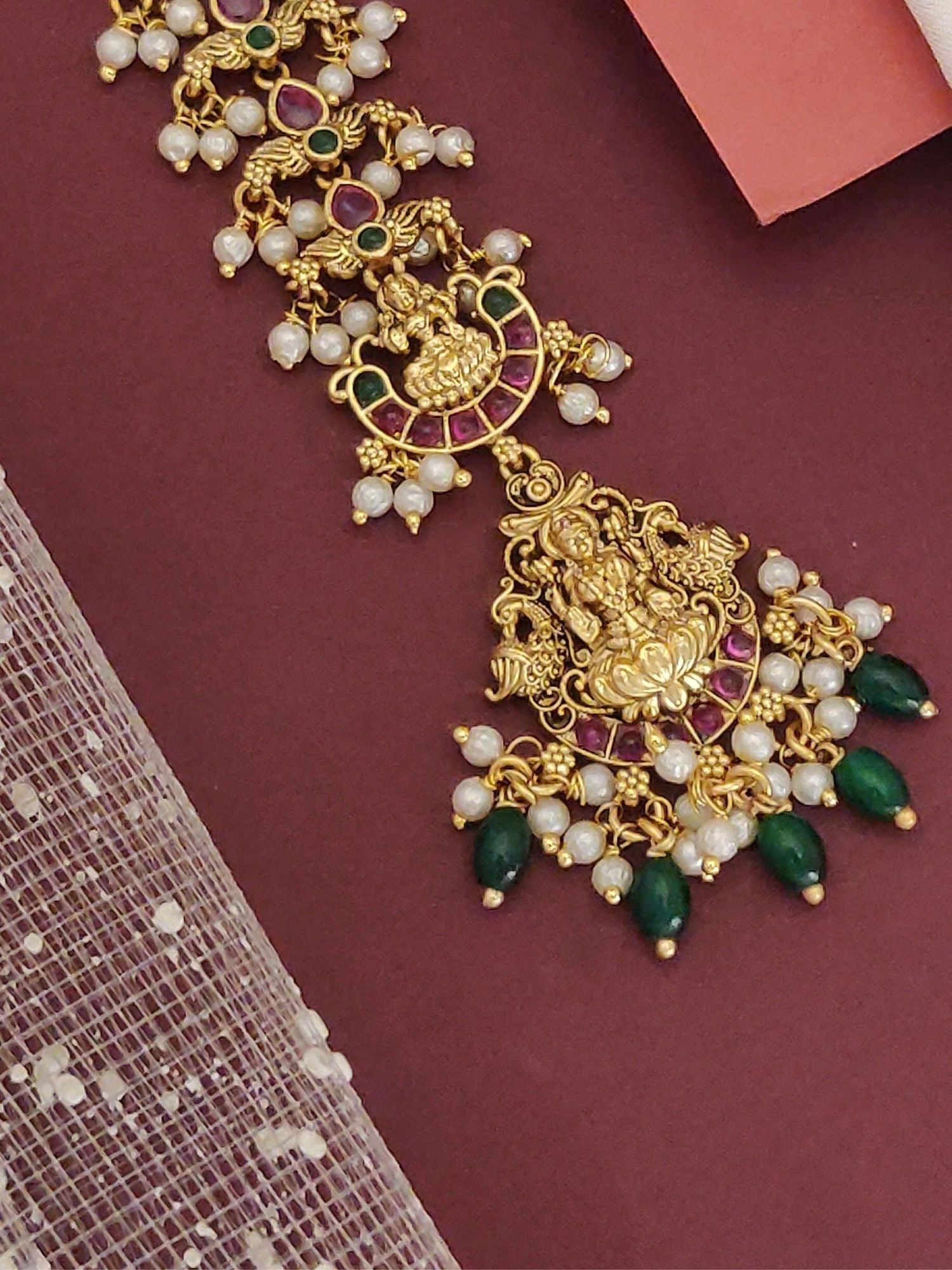 Matt gold plated head maangtikka by Abdesignsjewellery ornate temple motif with pearls green beads and pink enamel detailing