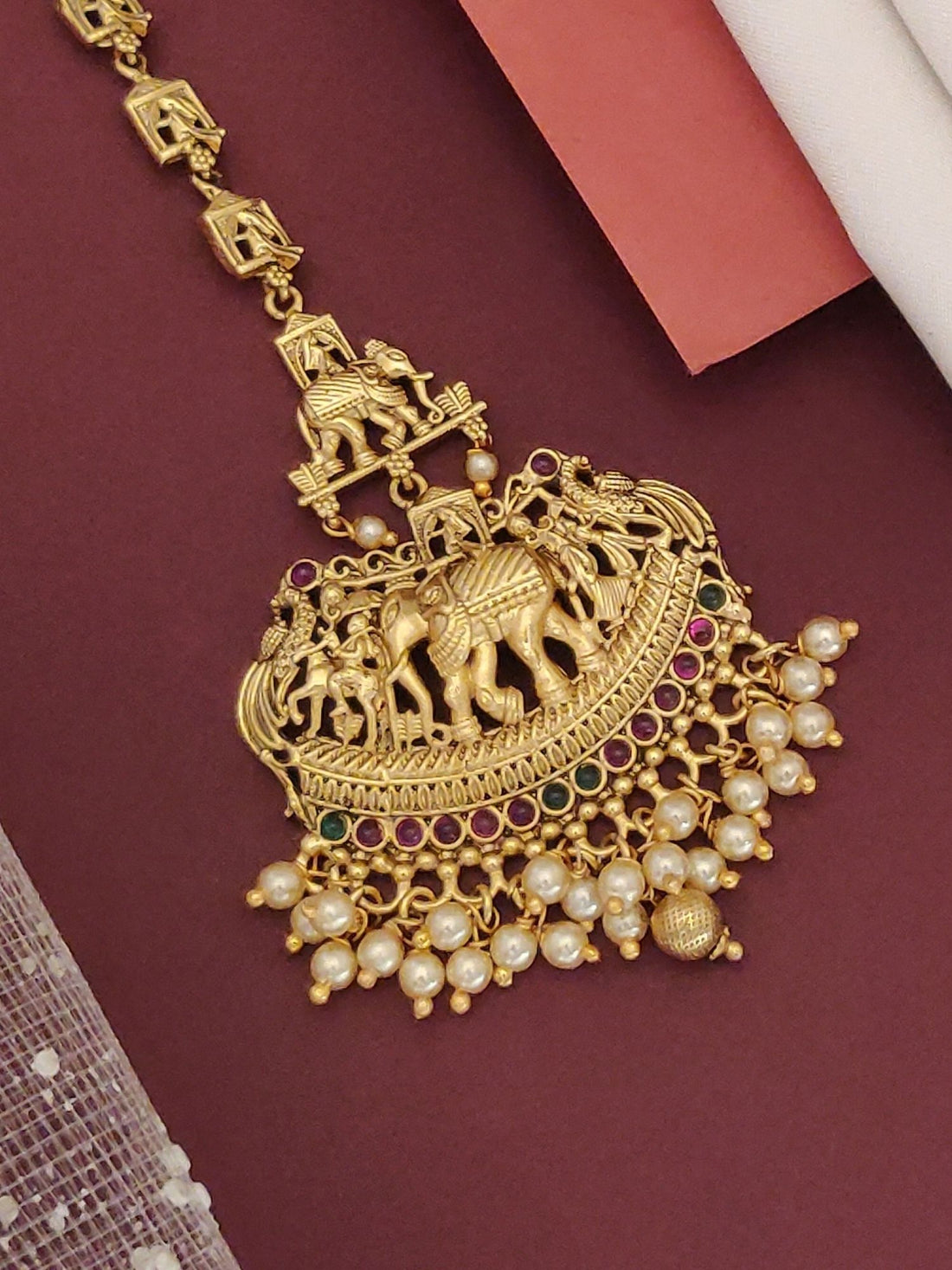 Matt Gold Plated KempStone Elephant Maangtikka with intricate designs and pearl embellishments