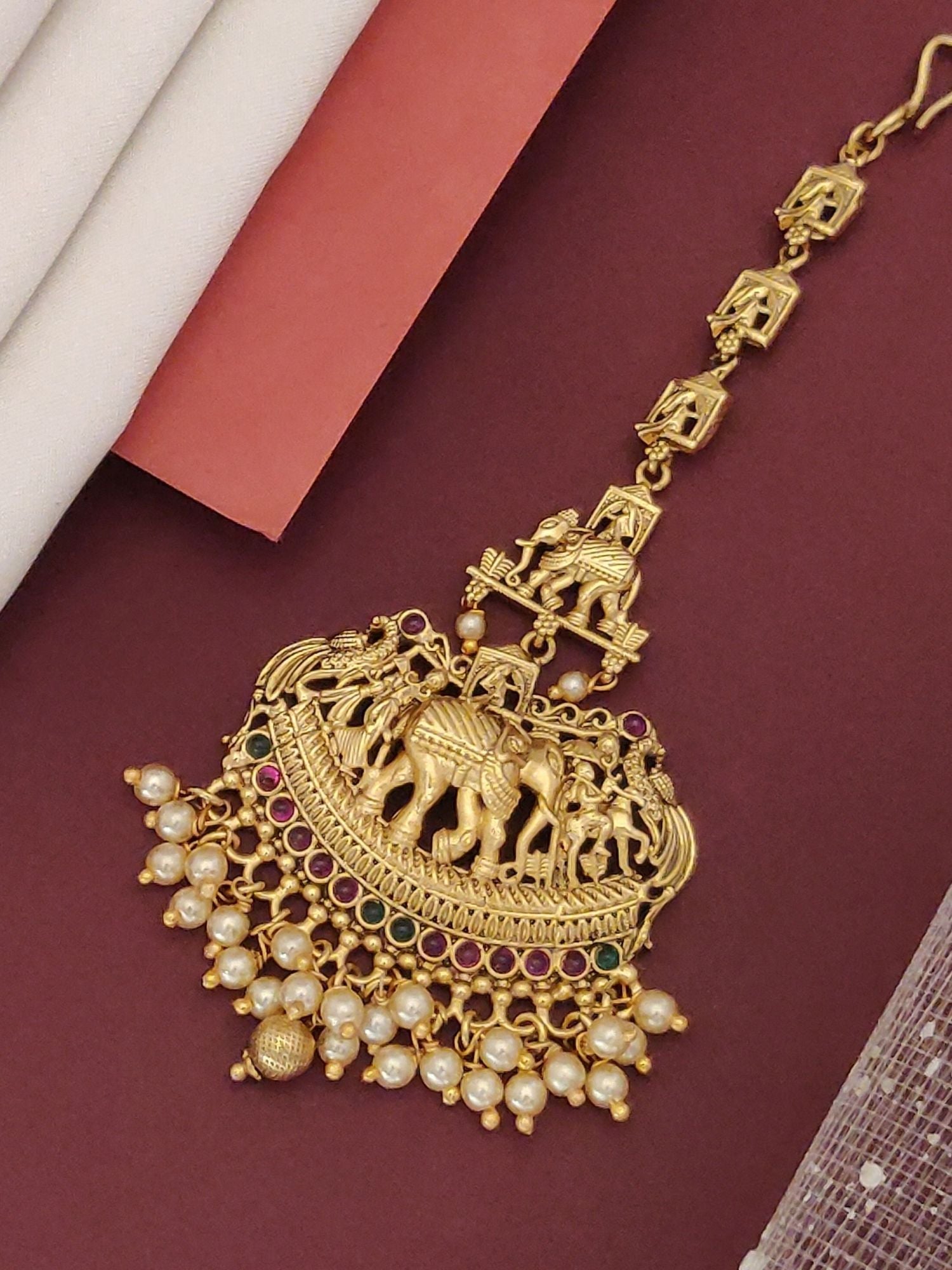 Matt Gold Plated KempStone Elephant Maangtikka with intricate design and pearl accents
