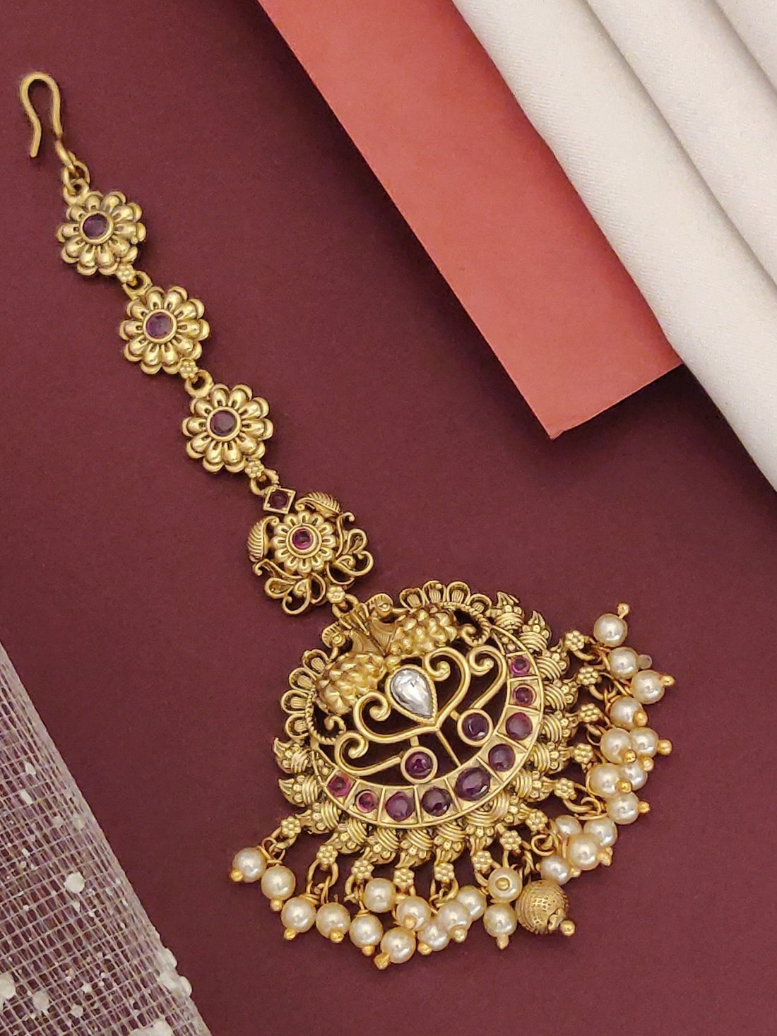 Matt Gold Plated KempStone Maangtikka with intricate design and elegant pearl detailing