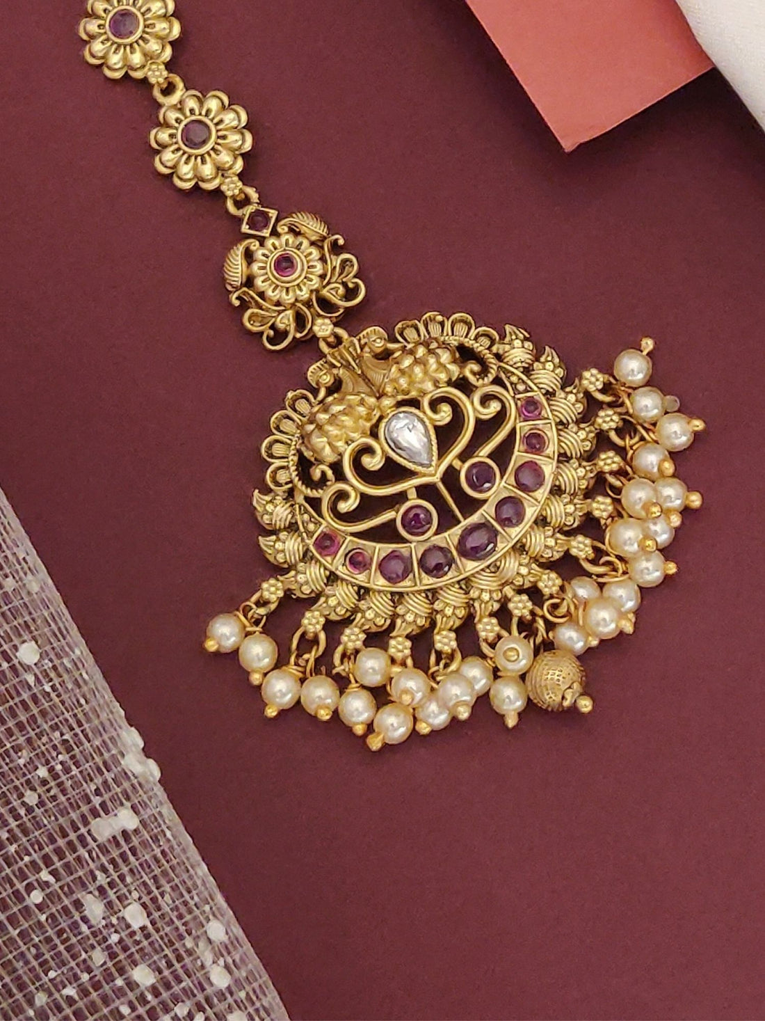 Matt Gold Plated KempStone Maangtikka with intricate design and elegant pearl detailing