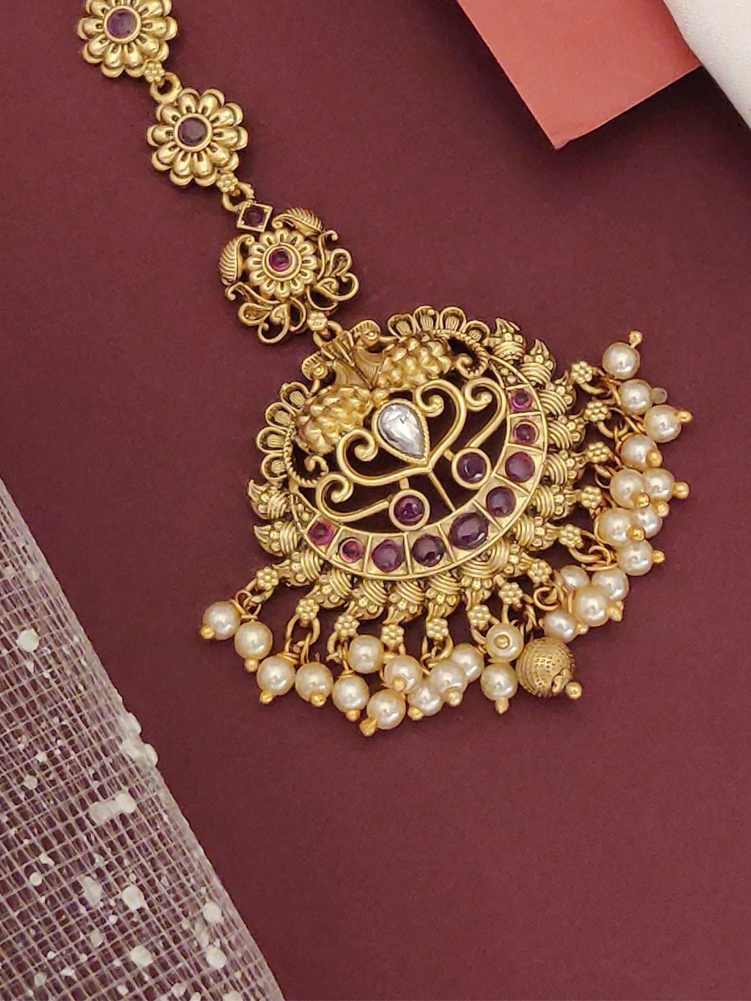 Elegant Matt Gold Plated KempStone Maangtikka with Pearl Drops and Intricate Detailing