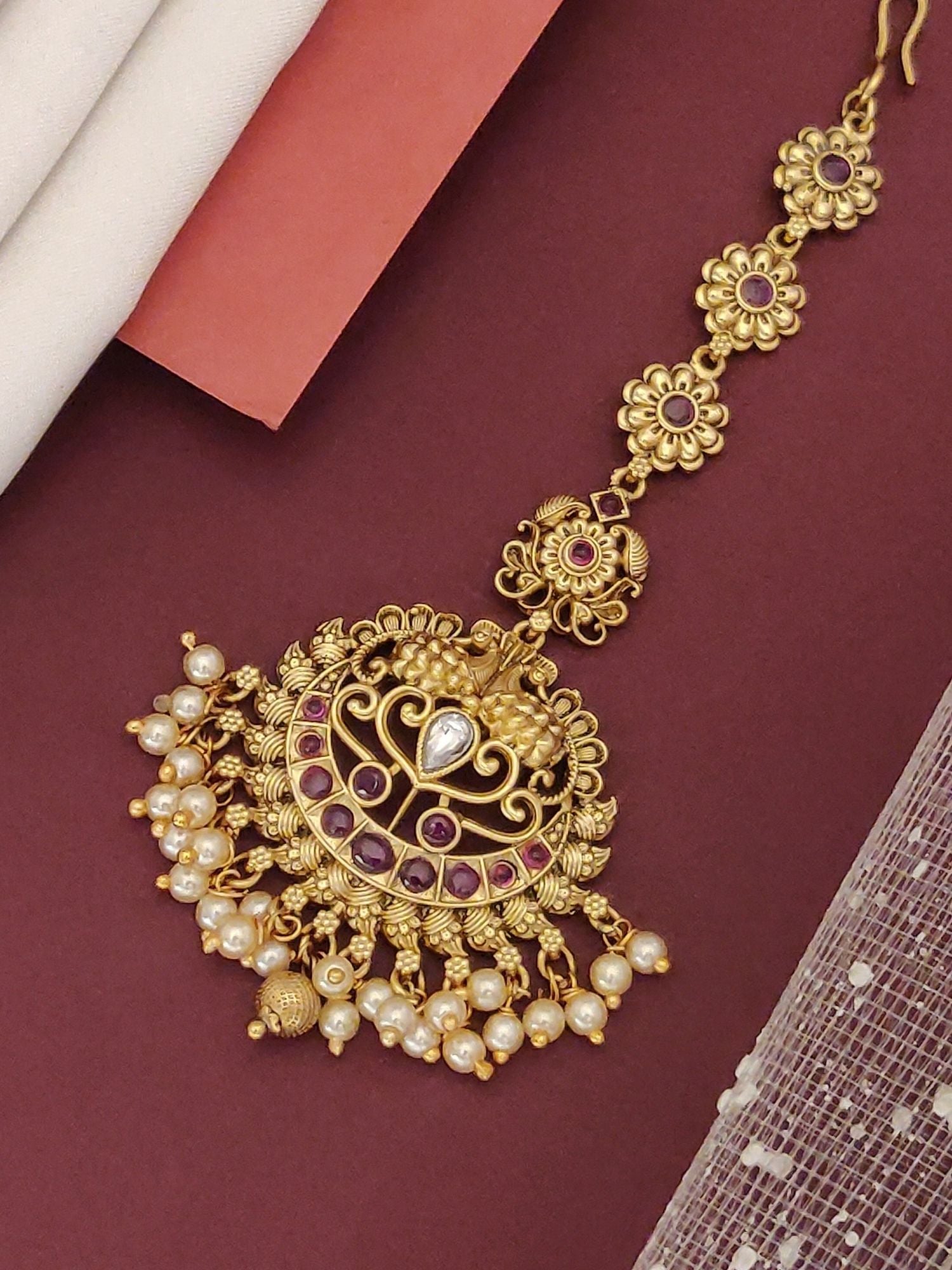 Matt Gold Plated KempStone Maangtikka with intricate design and pearl accents