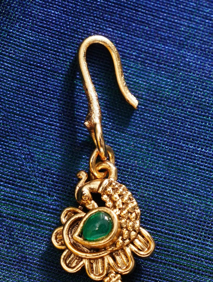 Matt Gold Plated KempStone Studed Maangtikka with intricate peacock design and green stone centerpiece