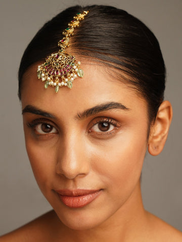 Matt Gold Plated KempStone Studed Maangtikka worn on forehead by woman with sleek hair