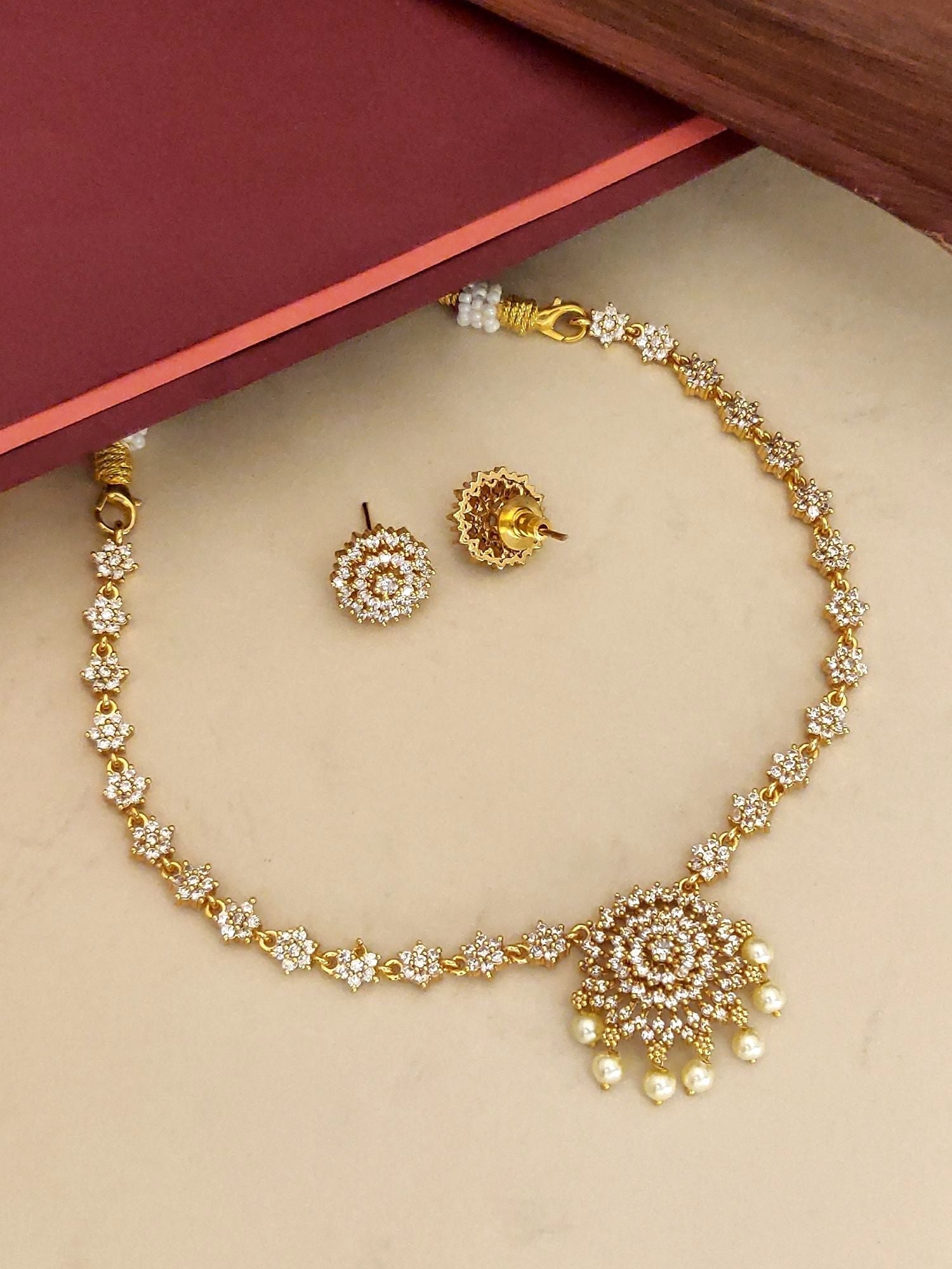 Minimal Gold Plated American Diamond Necklace Set with floral design and matching earrings