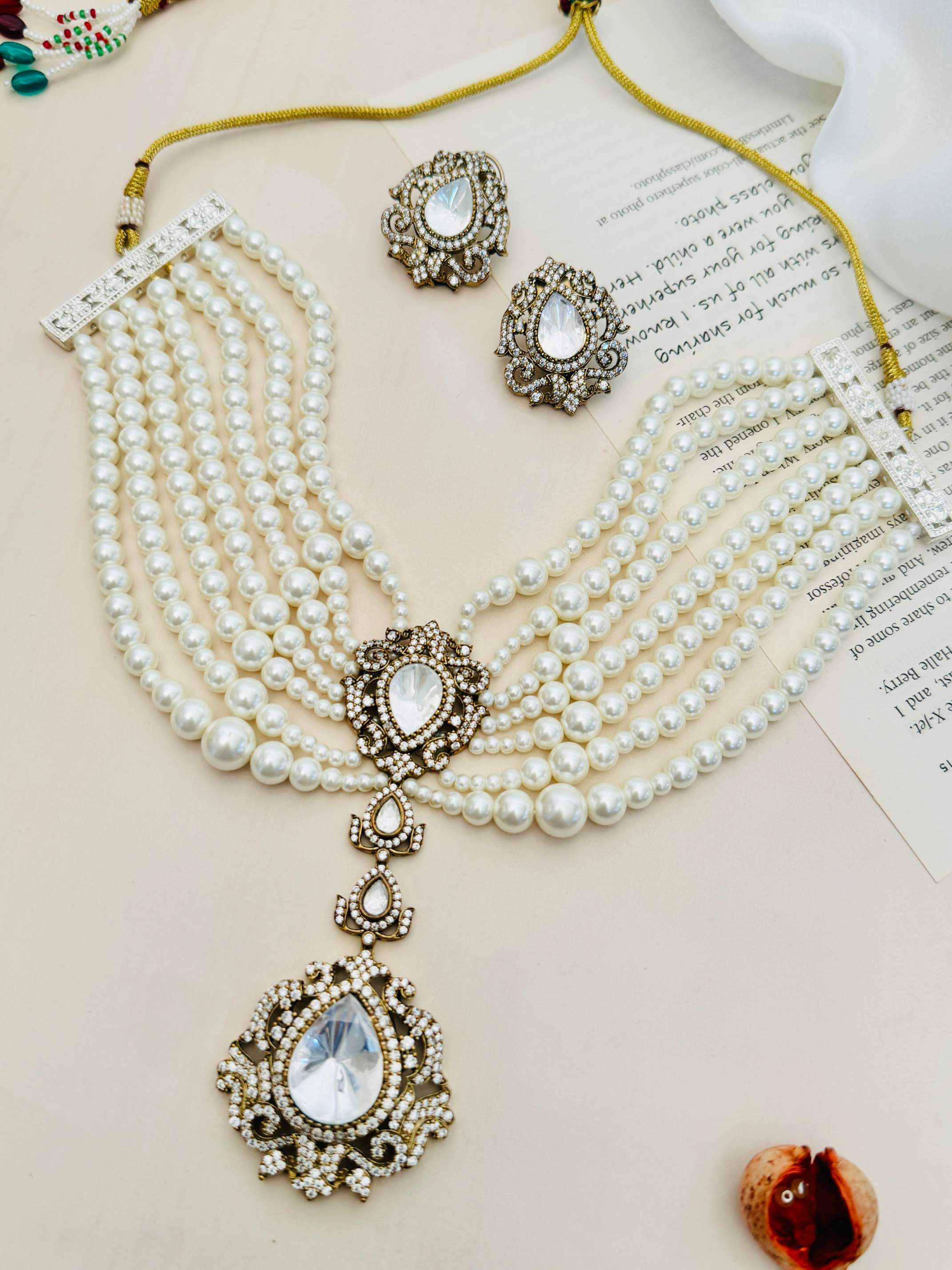 Pearl Choker Diamond Sabyasachi Necklace Set featuring multi-strand pearls with intricate diamond accents and matching earrings