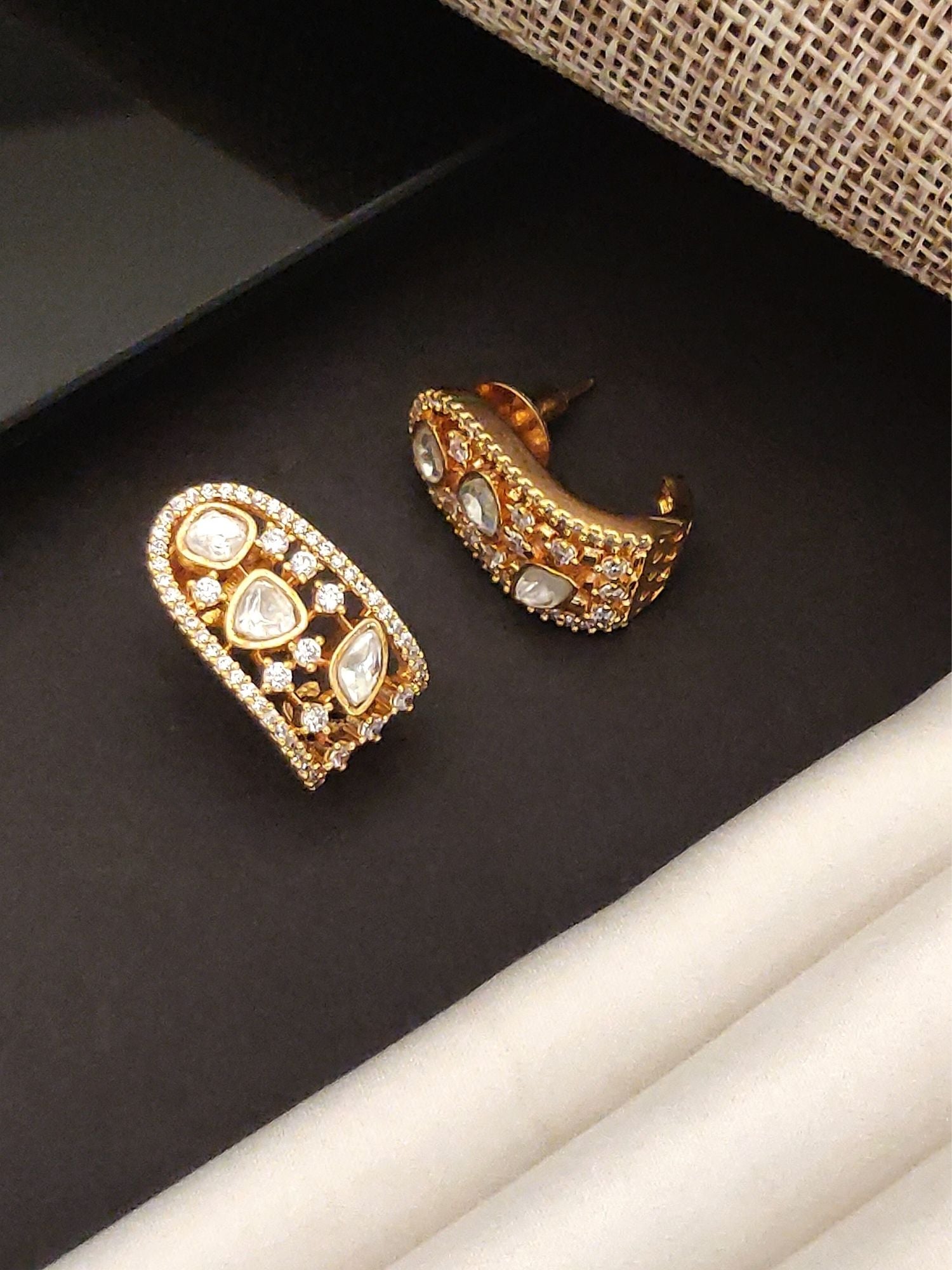 Polki Diamond Stud Earring set with gold detailing and multiple diamonds in various shapes