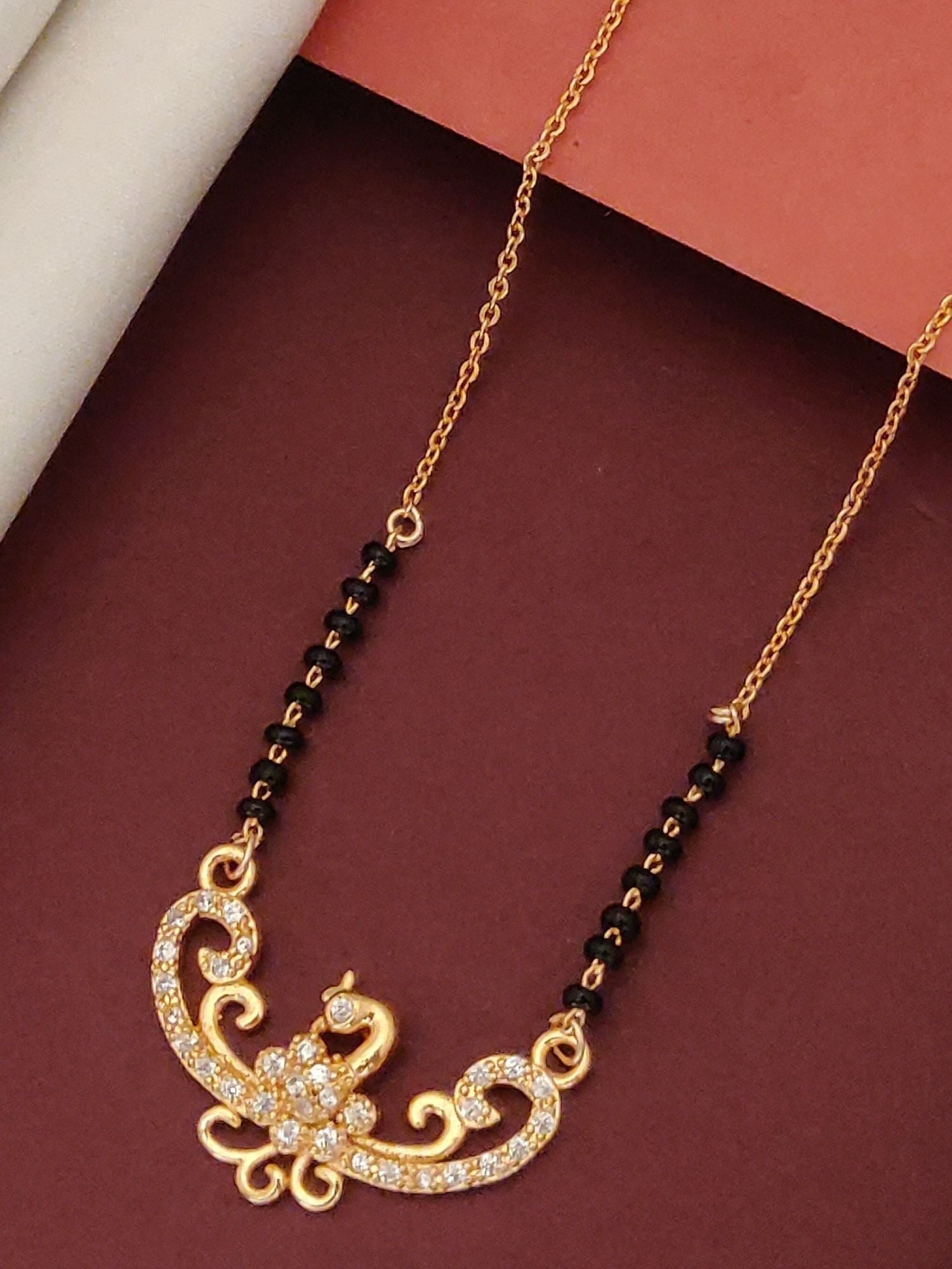 Elegant Rose Gold Plated Black Beads Mangalsutra with intricate design and sparkling embellishments