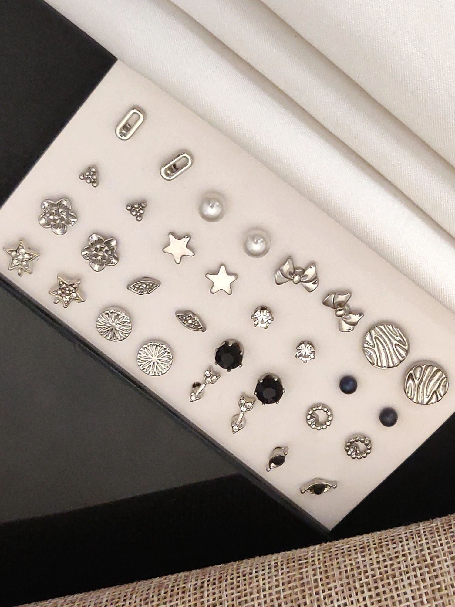 Set Of 16 Silver Plated Western Studs Earring Combo displayed on a sleek background, showcasing various designs