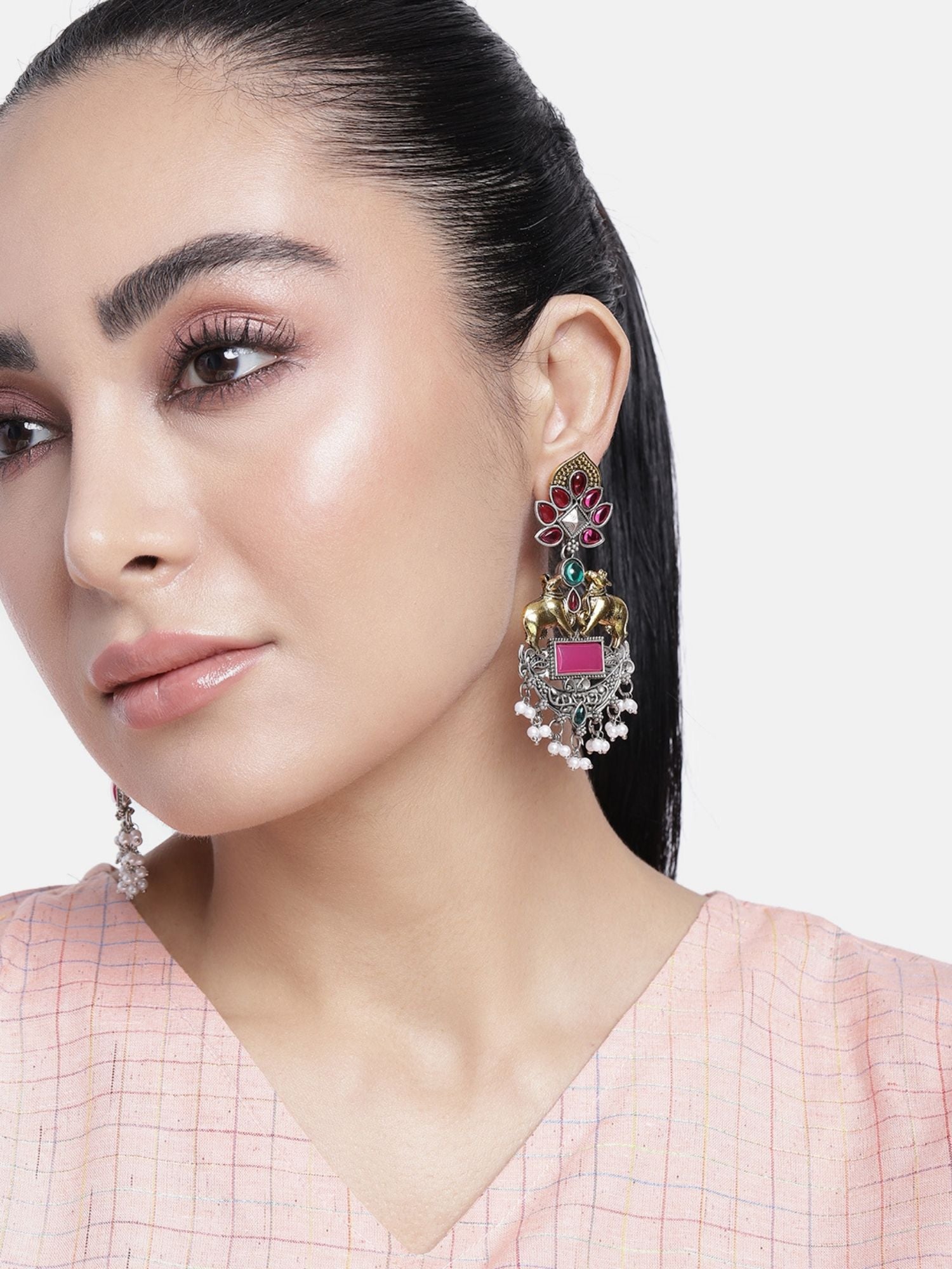 Elegant model wearing a Set Of 2 German Silver Earring Combo featuring colorful embellishments