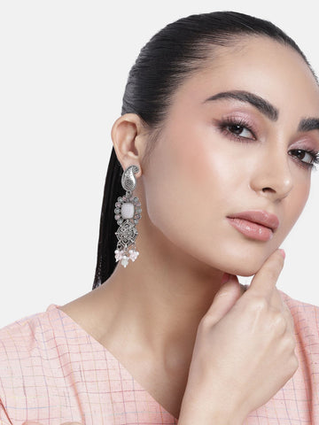 Stylish woman wearing a Set Of 2 German Silver Earring Combo with intricate designs and stones