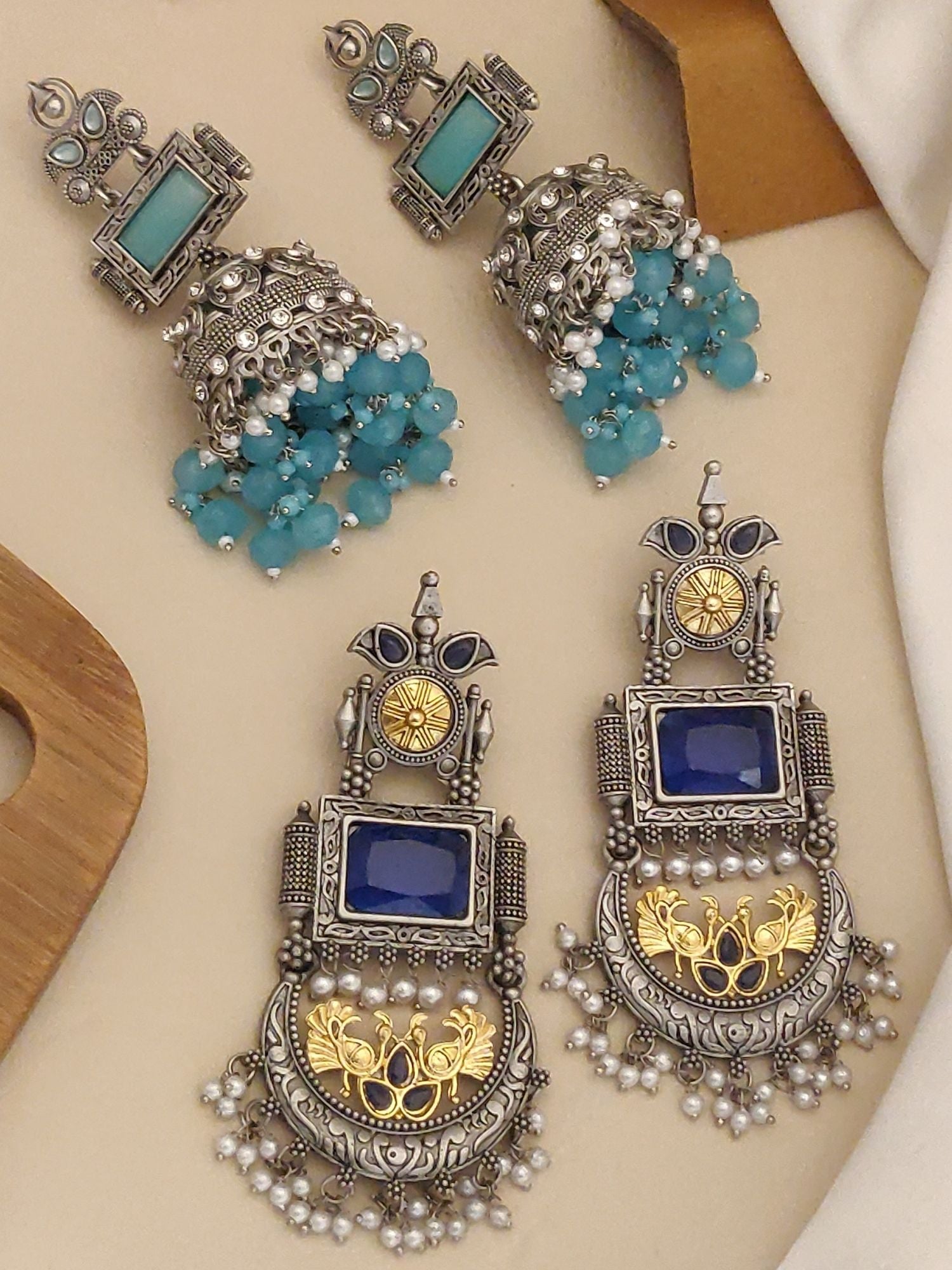 Set Of 2 German Silver Earring Combo featuring intricate designs and vibrant blue stones