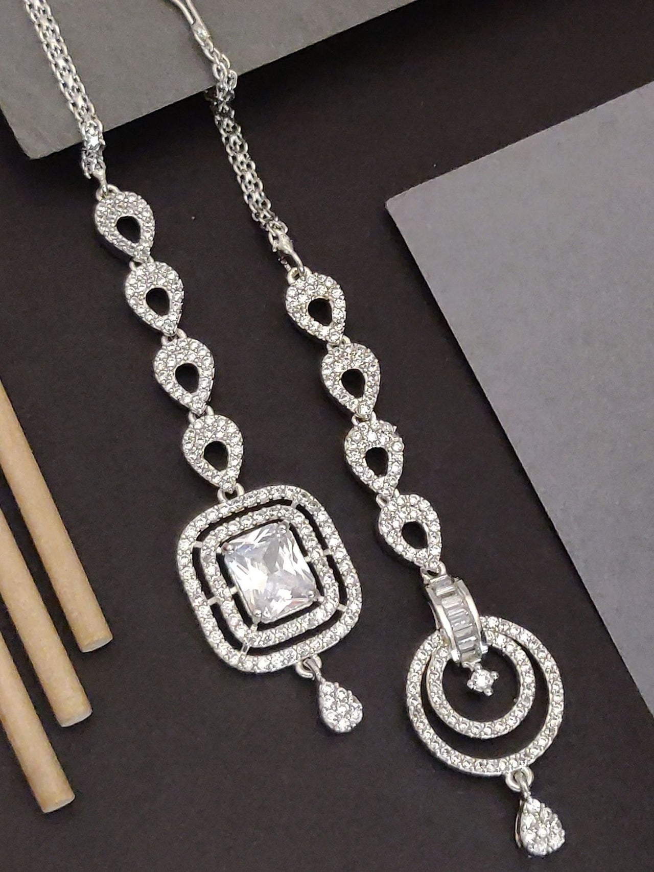 Set Of 2 Silver Plated American Diamond Maangtikka featuring intricate designs and sparkling stones