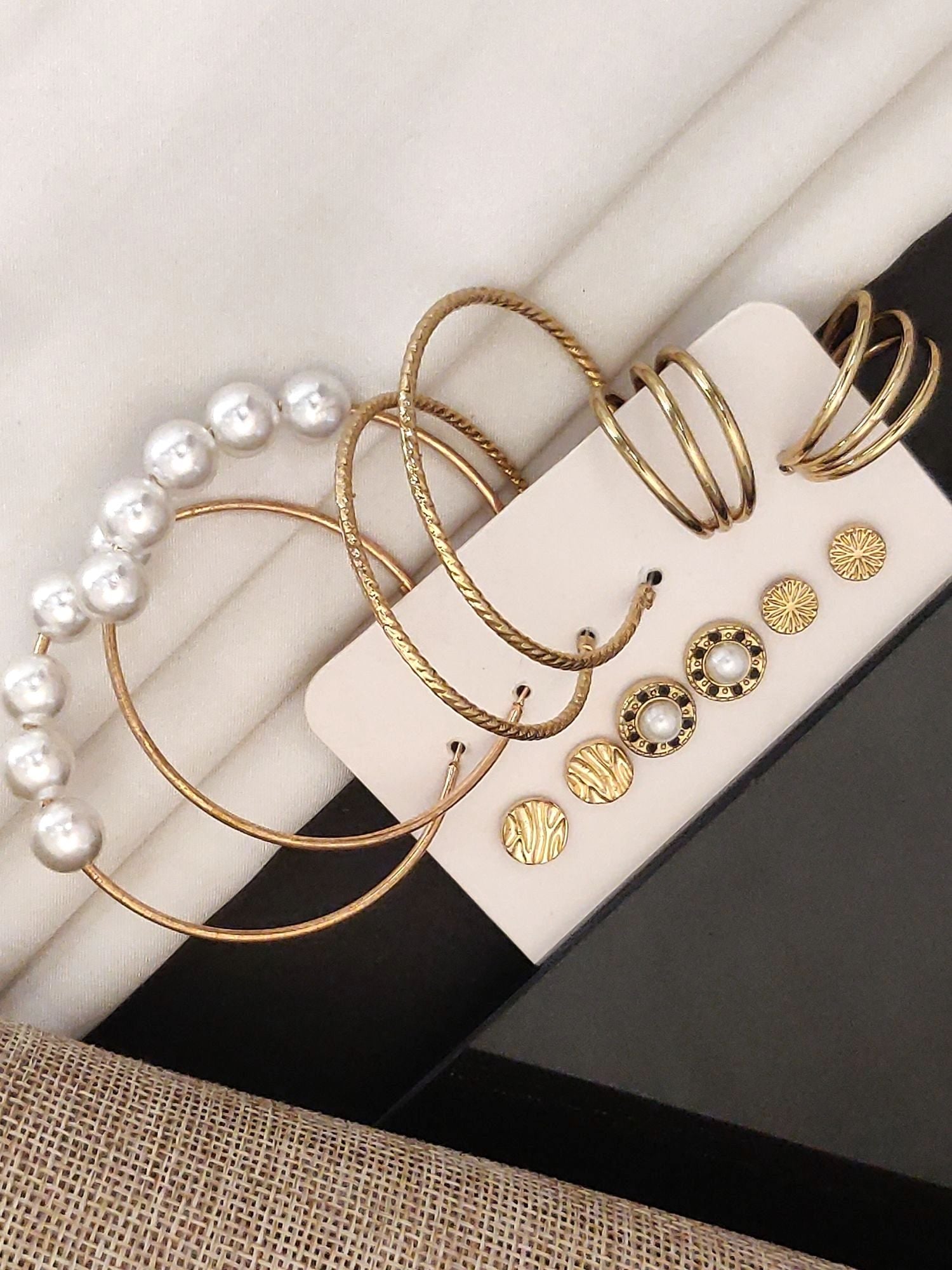 Set of 6 Gold Plated Hoops Earring with Pearl and Textured Designs on Display