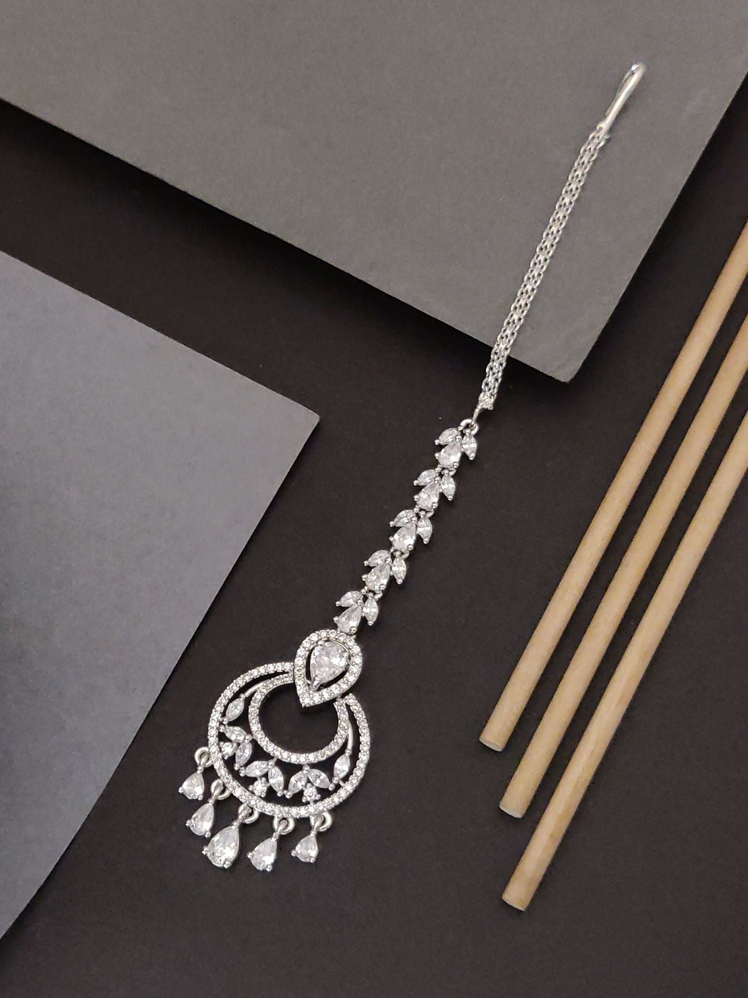 Silver Plated American Diamond MaangTikka with intricate design and hanging embellishments