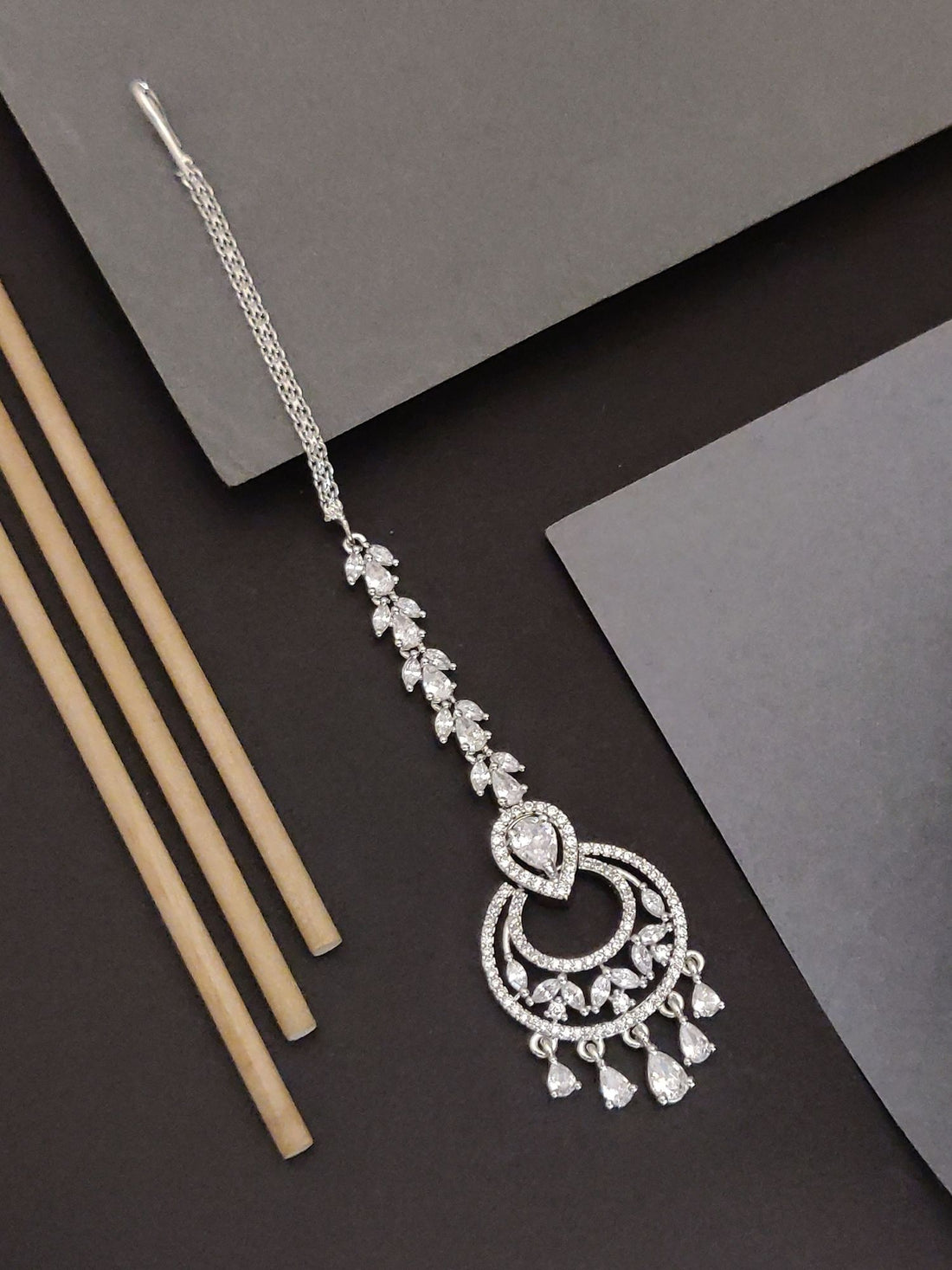 Silver Plated American Diamond MaangTikka with intricate design and dangling elements