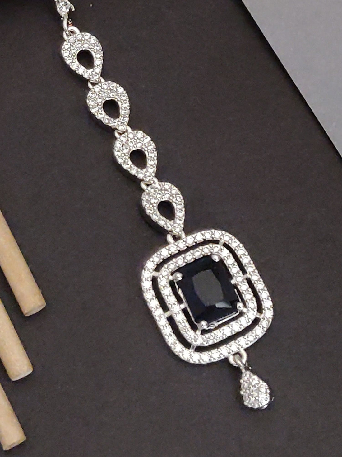 Silver Plated American Diamond MaangTikka with intricate design and dark stone centerpiece