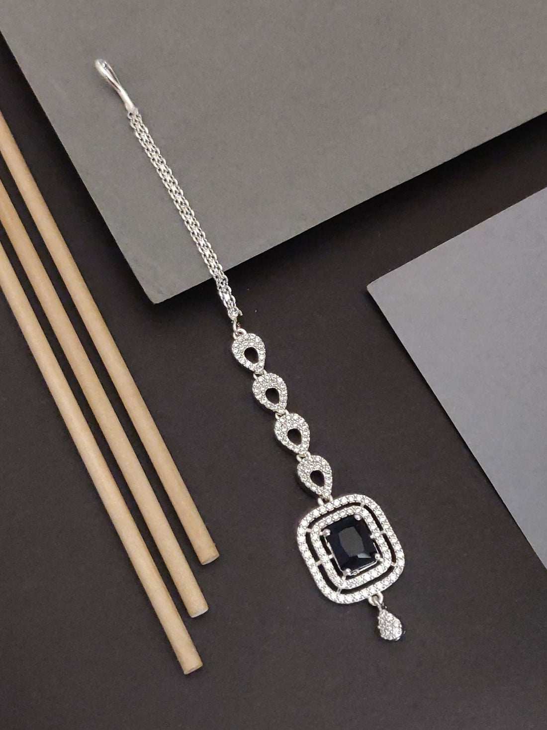 Silver Plated American Diamond MaangTikka with intricate design and dark stone centerpiece