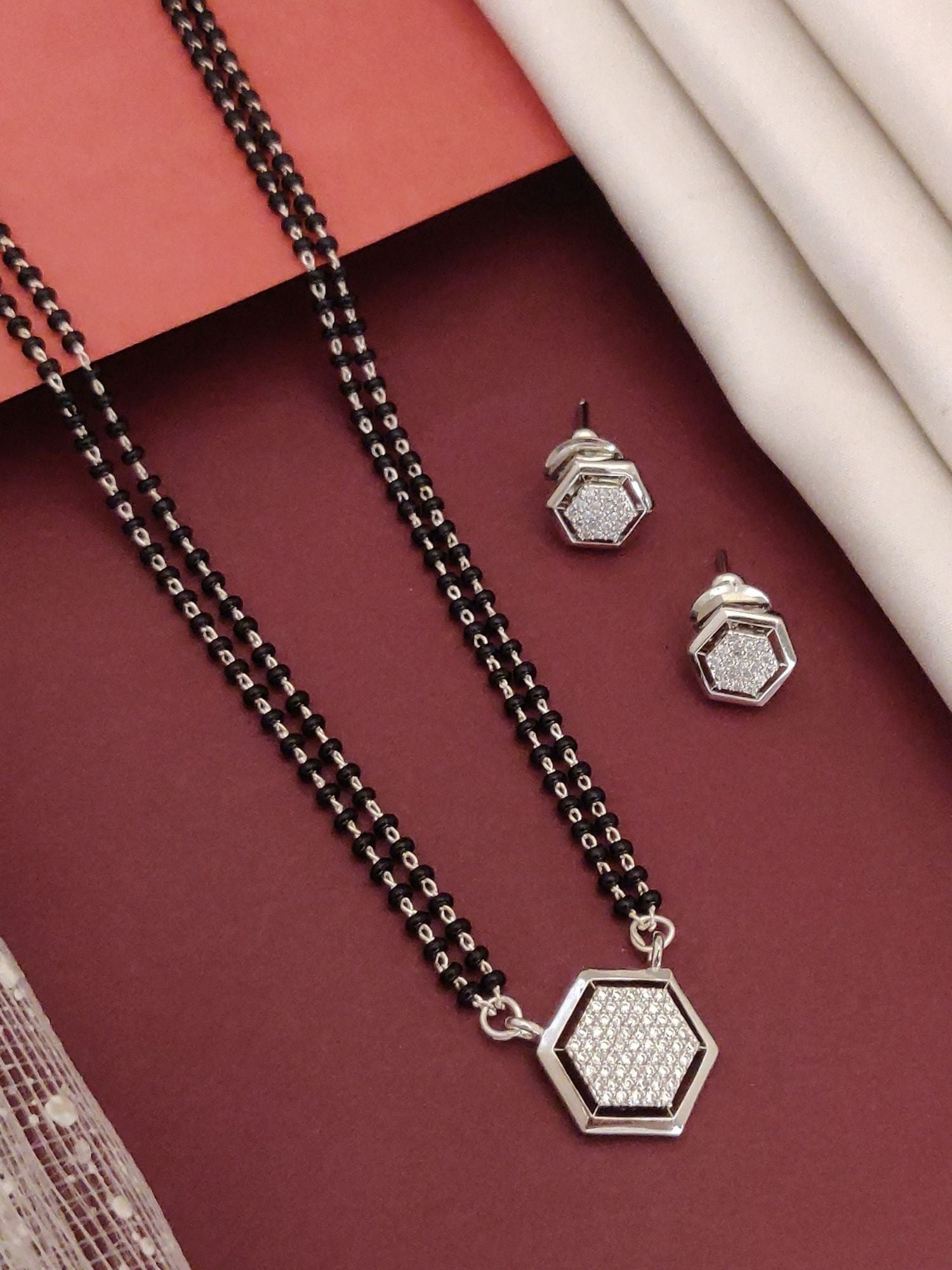 Silver Plated American Diamond Mangalsutra Set with a hexagonal pendant and matching earrings