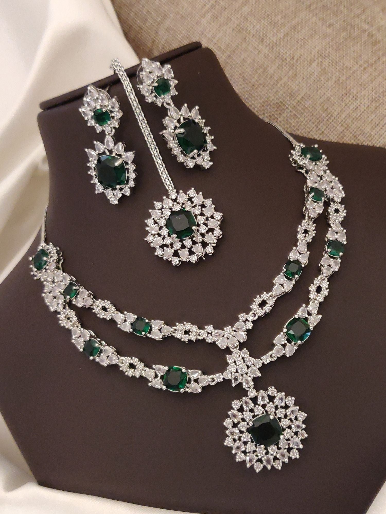 Silver plated American diamond necklace set with elegant emerald stones and matching earrings