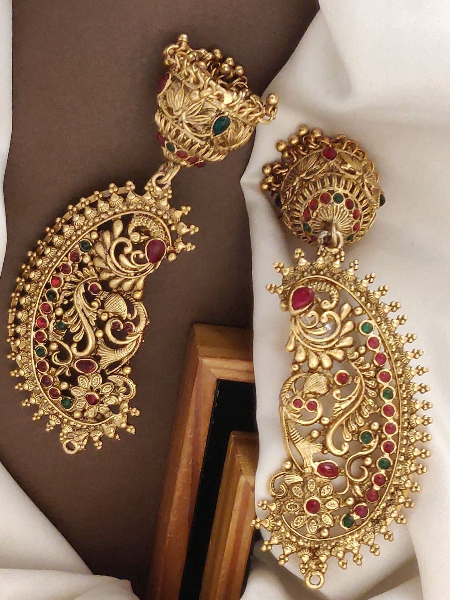 Elegant South Indian style gold plated ear cuffs with intricate designs and colorful gemstones