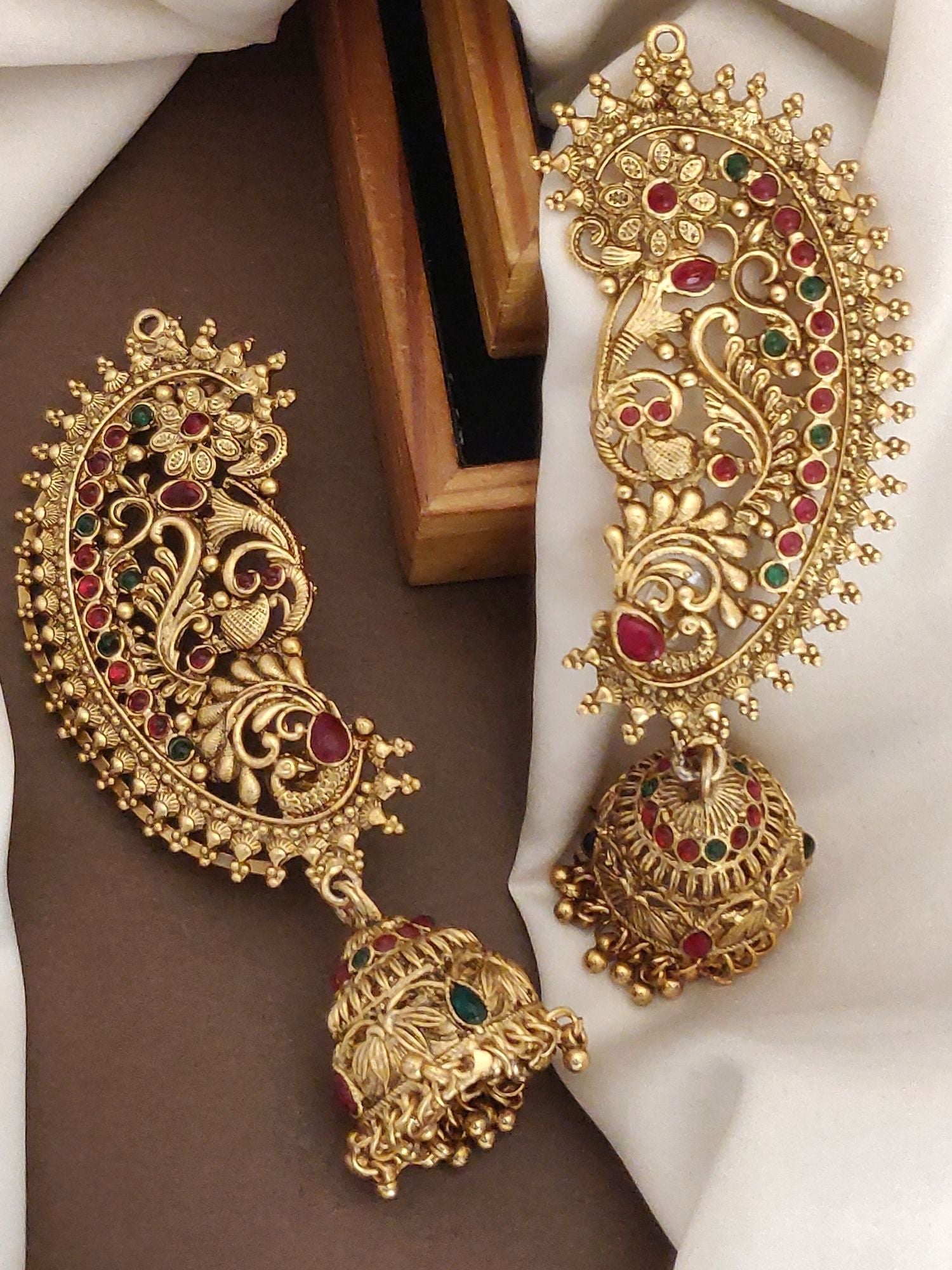 South Indian style gold plated ear cuffs with intricate designs and colorful gemstone accents