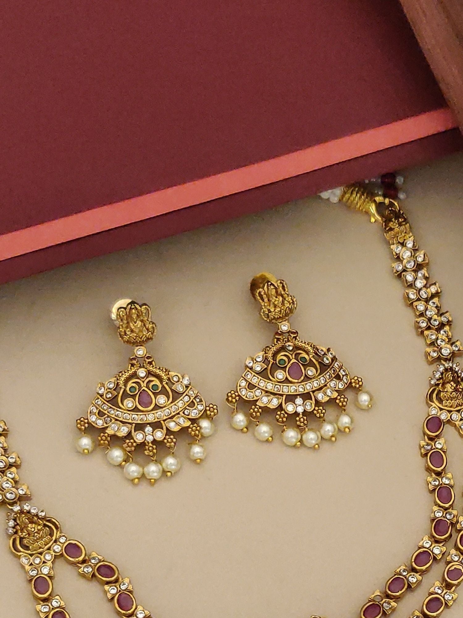 Abdesignsjewellery gold necklace and jhumka earrings with ruby stones and pearl drops South Indian temple jewellery set