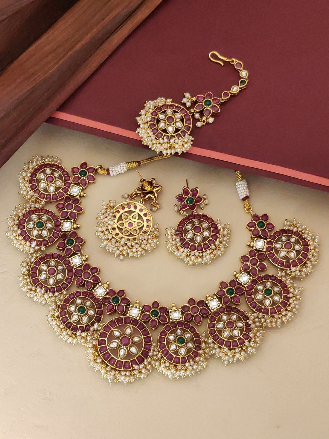 Abdesignsjewellery Southindian Necklace Set gold tone with red and green stones and pearl fringe includes earrings and maang tikka