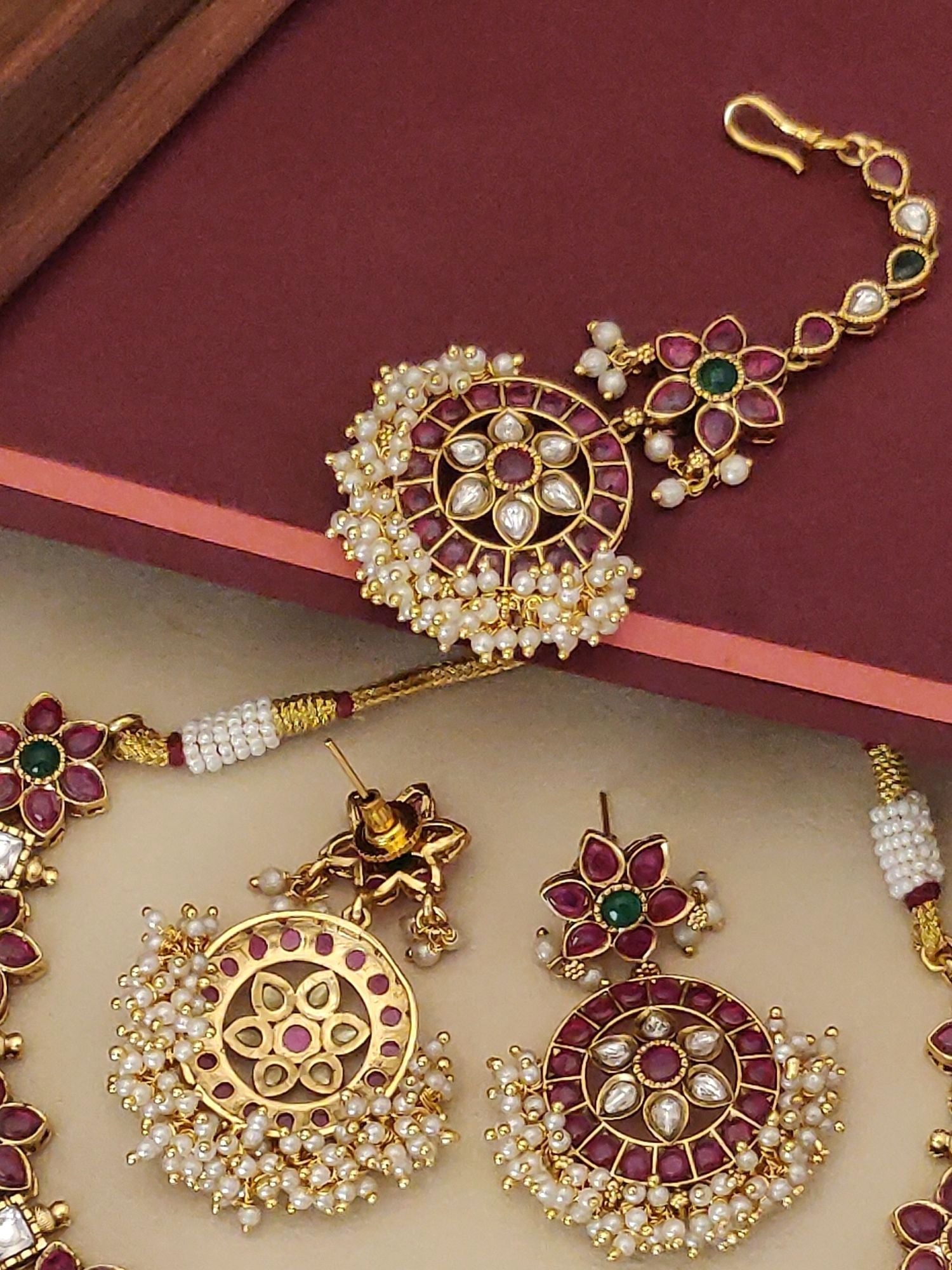 Abdesignsjewellery Southindian Necklace Set with gold tone circular pendant red green stones and pearl fringe