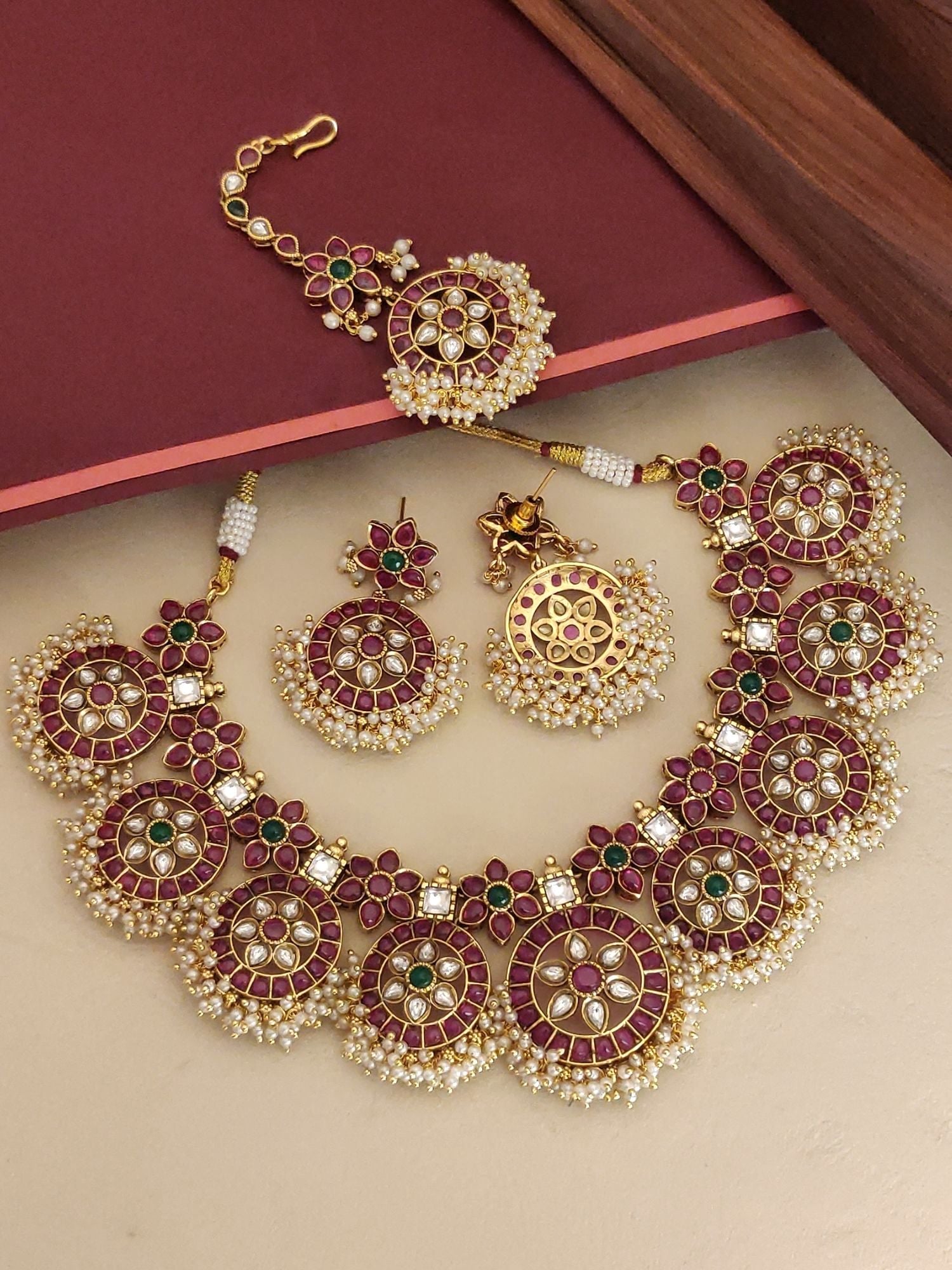Abdesignsjewellery Southindian Necklace Set gold tone with ruby and green stones floral motifs and pearl fringe