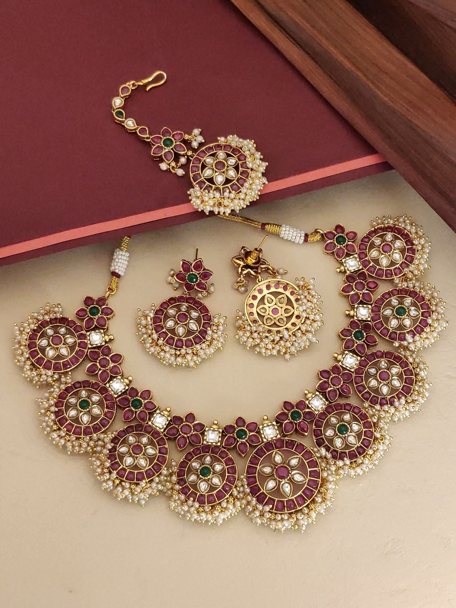 Abdesignsjewellery Southindian Necklace Set gold tone with red and green stones and pearl fringe includes earrings and maang tikka