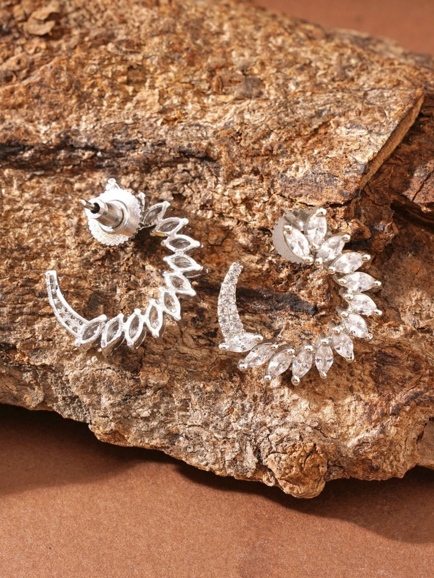 Sparkling Silver Plated American Diamond Stud Earring set by Abdesignsjewellery on textured brown surface