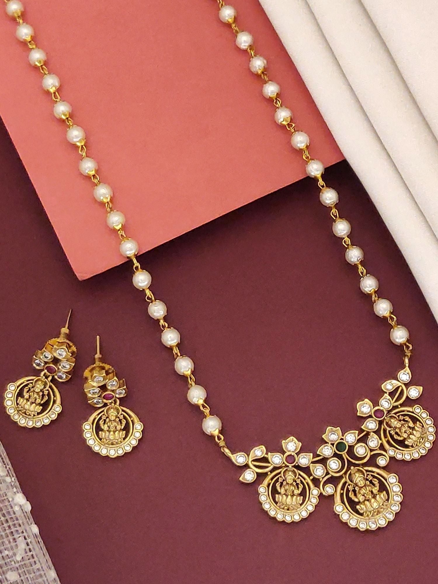 Temple Pendant Necklace Set in gold featuring intricate designs and matching earrings with pearls