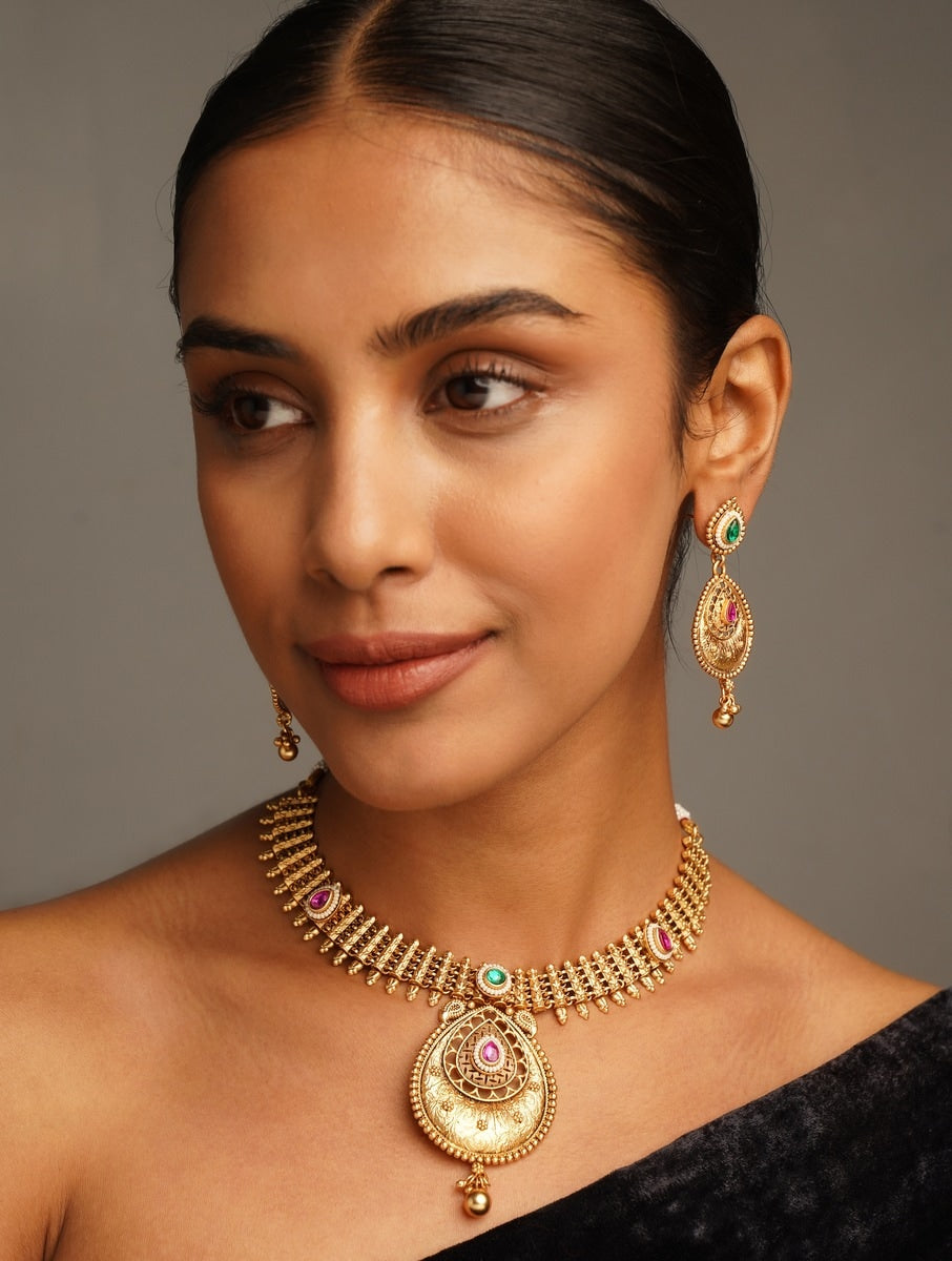 Traditional Antique Golden Plated Matt Finish Necklace Set worn by woman with matching earrings by Abdesignsjewellery