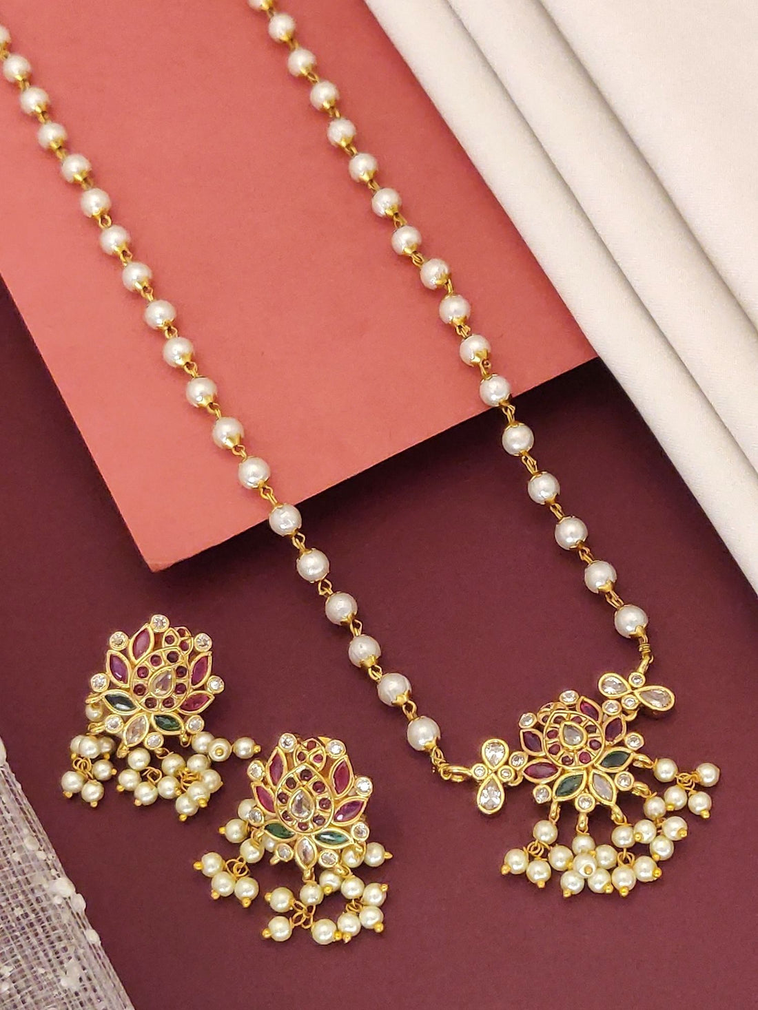 Traditional gold plated necklace with intricate design and pearl embellishments from Abdesignsjewellery
