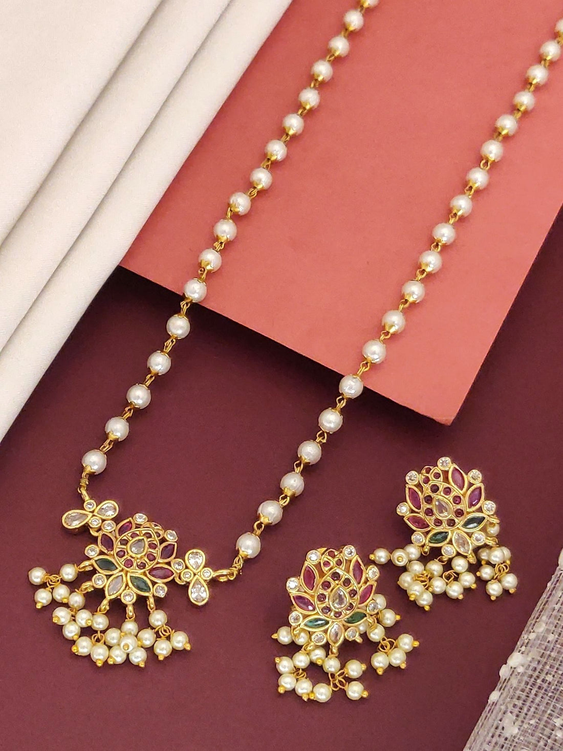 Traditional gold plated necklace with intricate design and pearl embellishments from Abdesignsjewellery